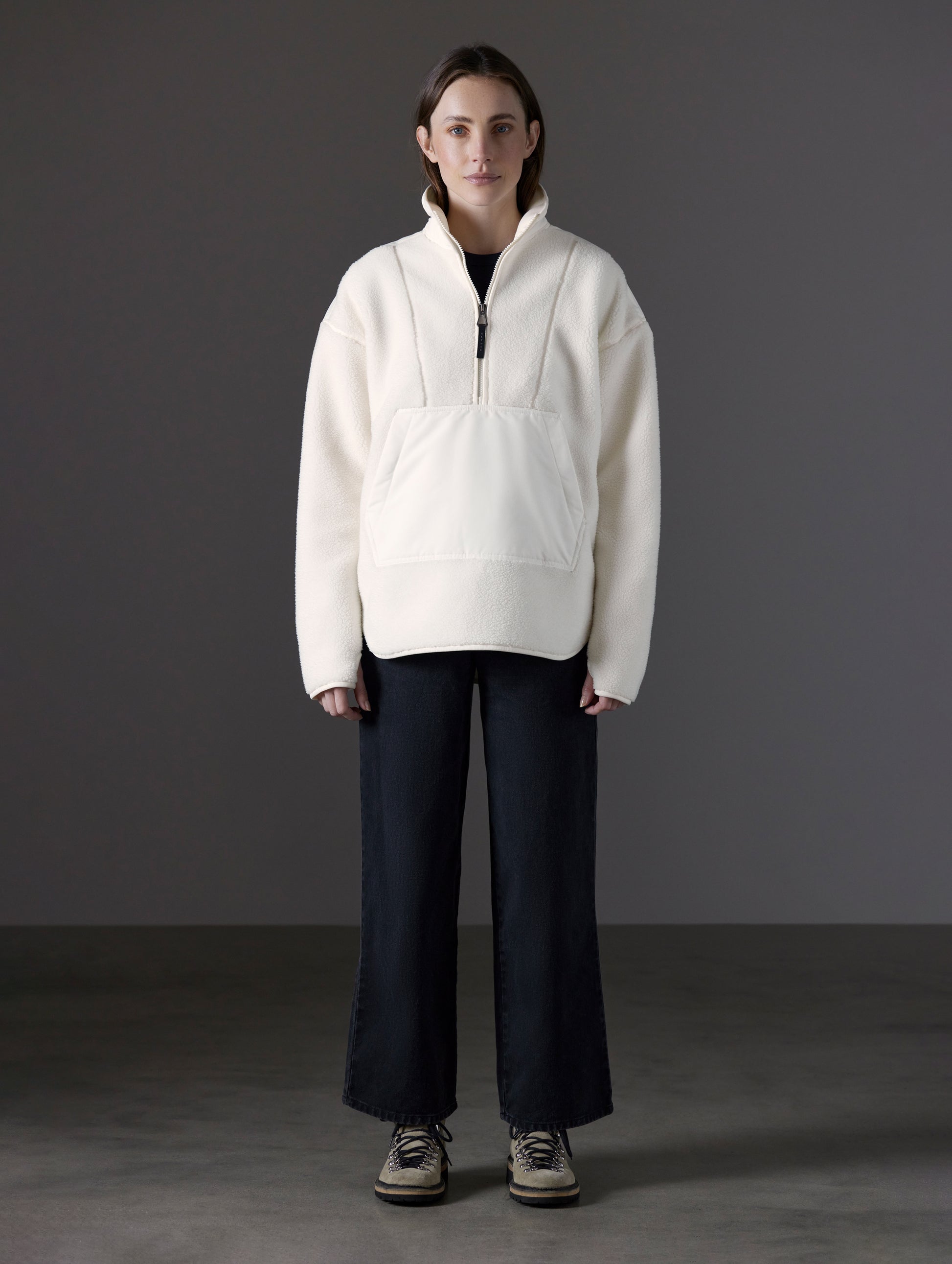 Front full-body view of woman wearing Terrain Fleece Anorak in Winter White from AETHER Apparel.