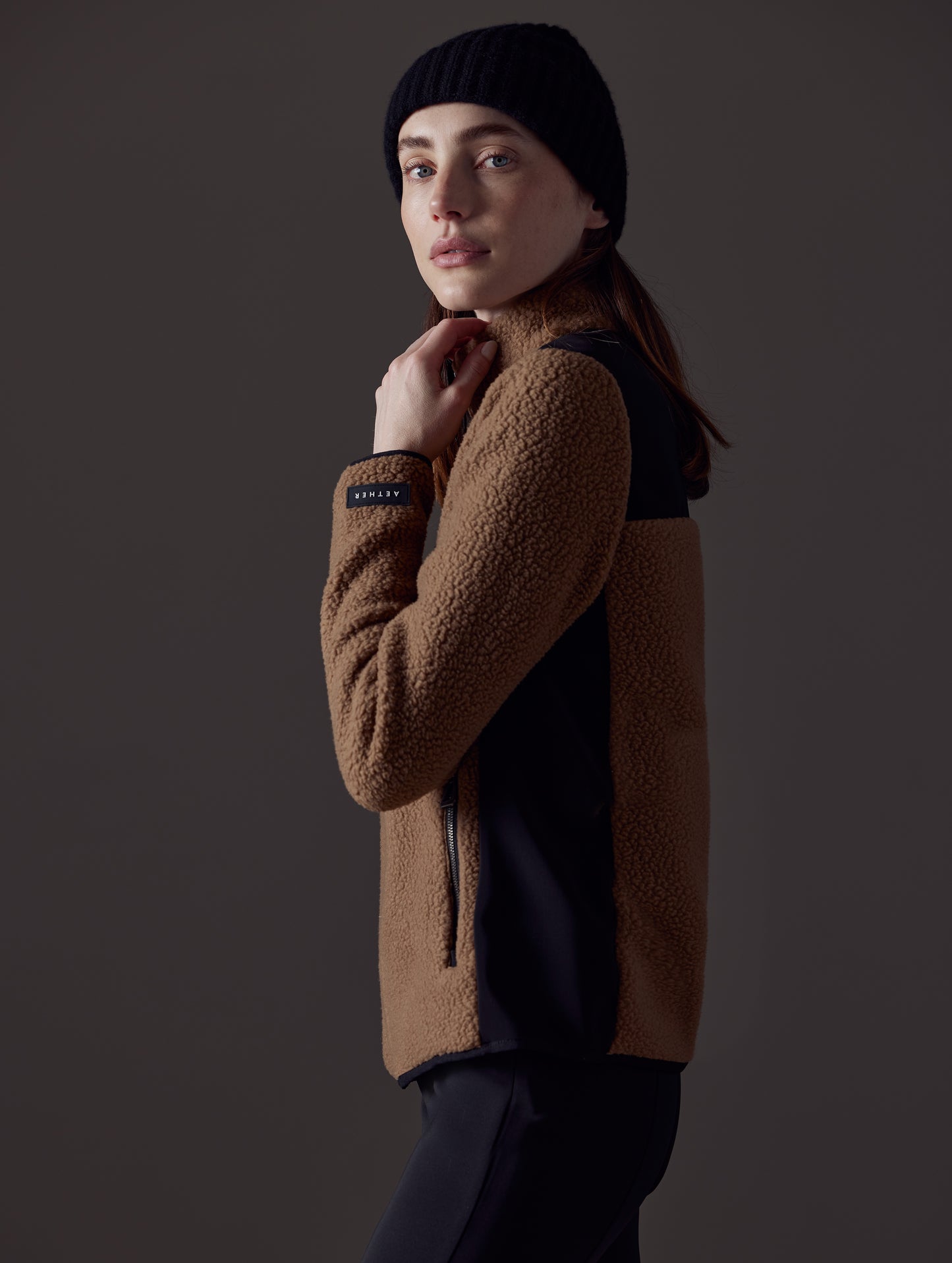 Woman wearing brown fleece from AETHER Apparel