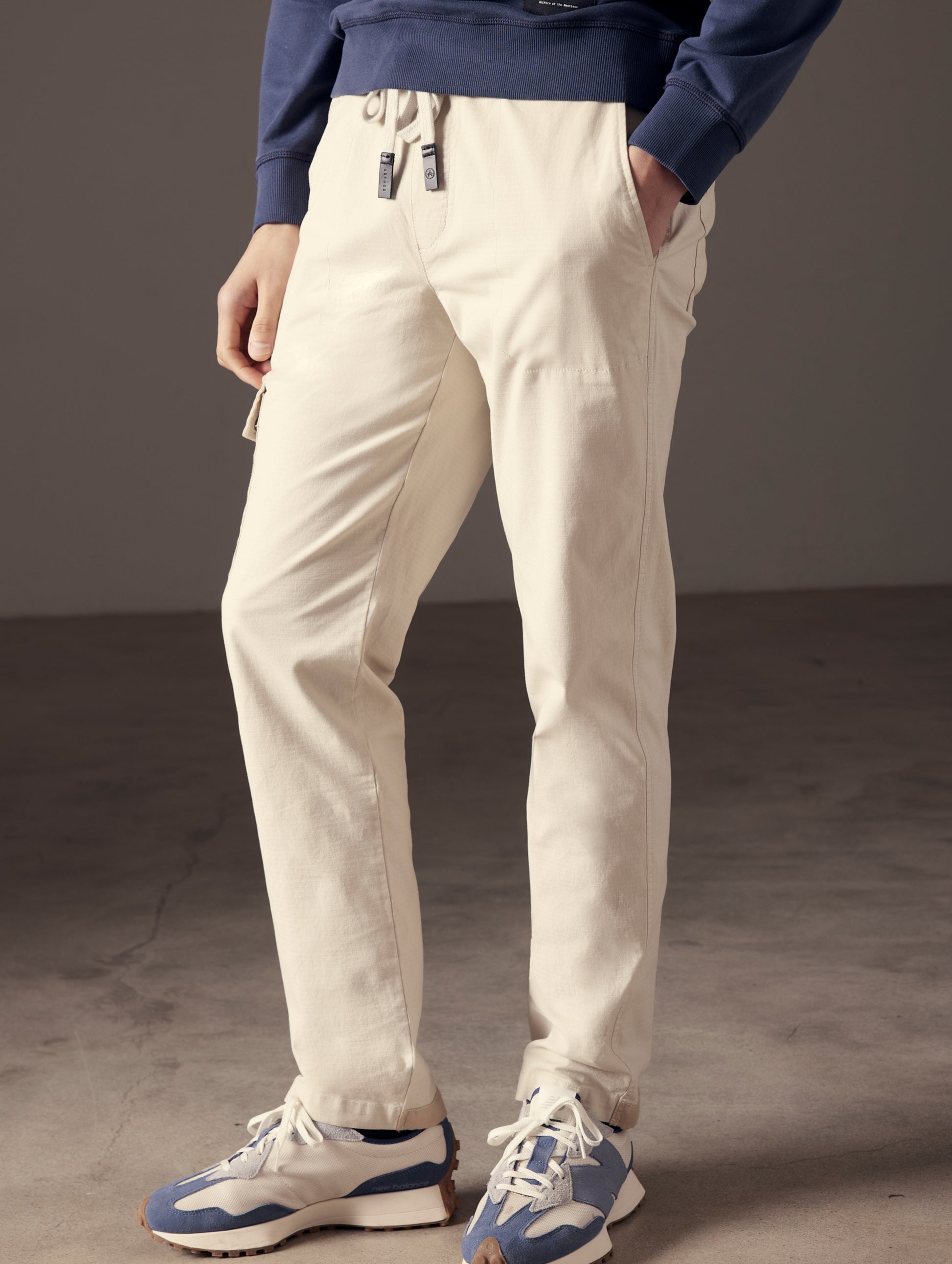man wearing beige cotton ripstop pants