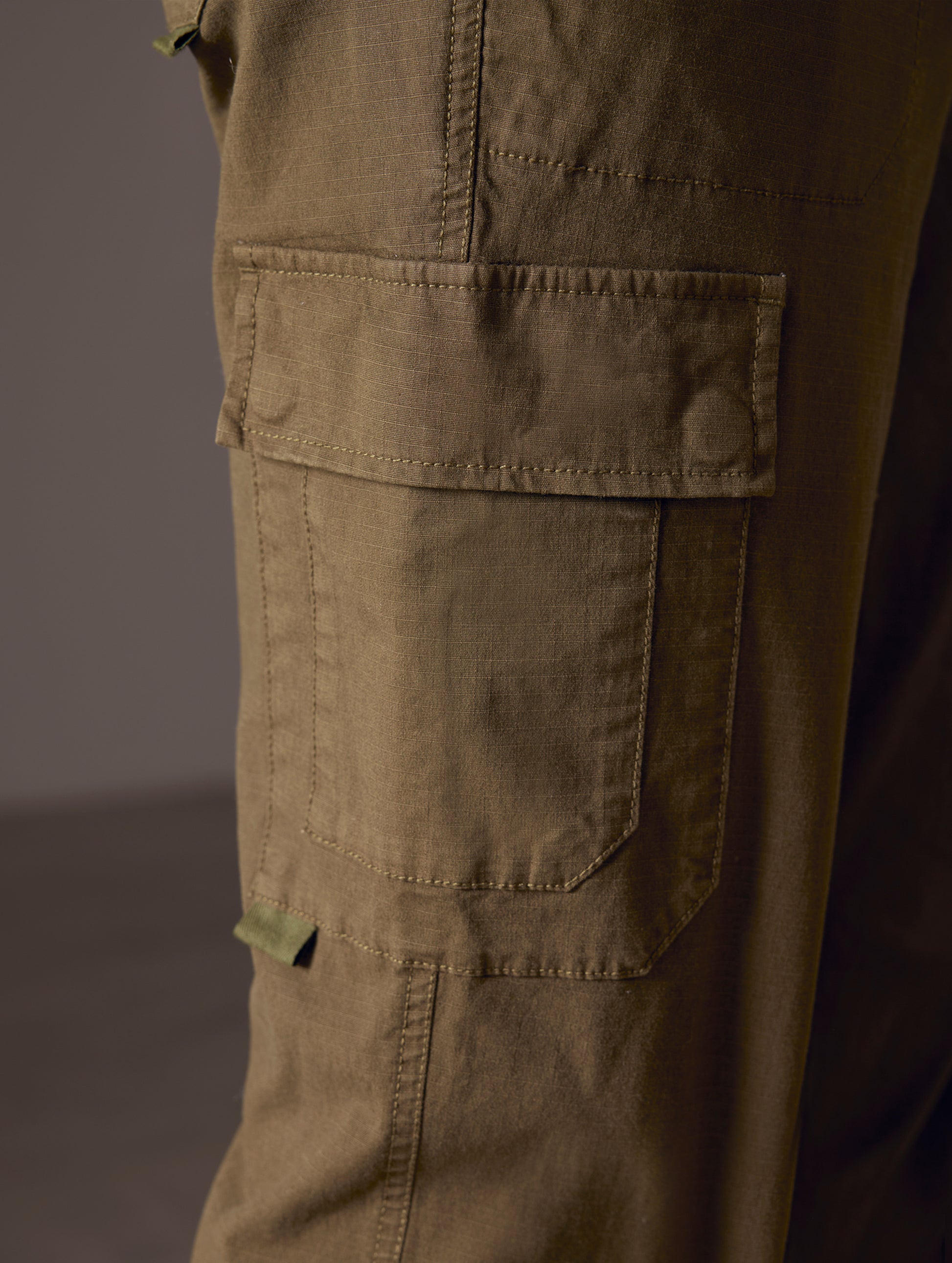 pocket close-up of green cotton ripstop pants from AETHER Apparel