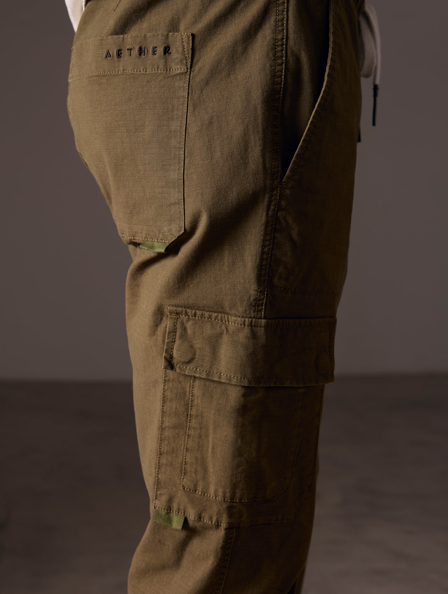side view of man wearing green cotton ripstop pants
