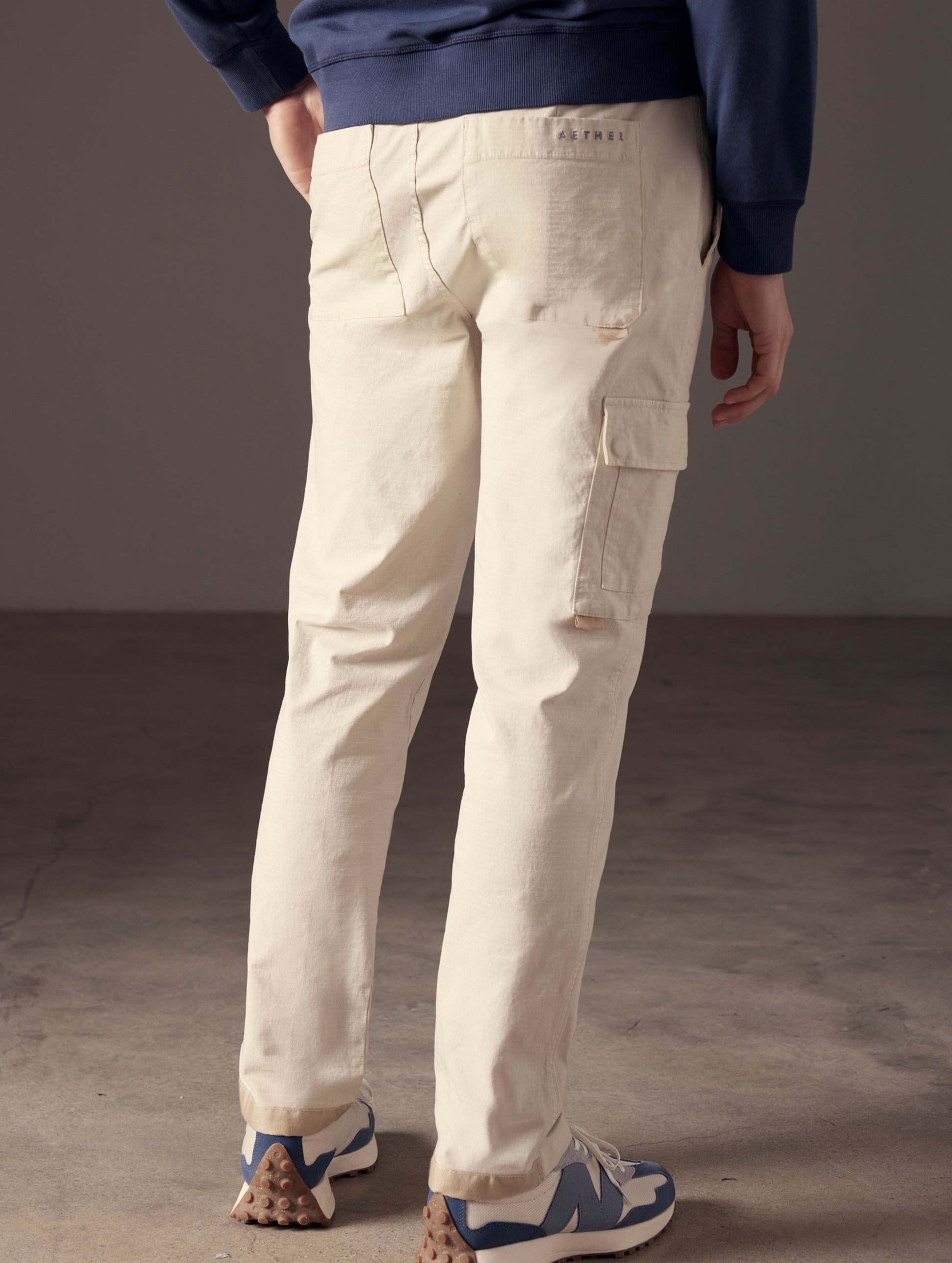 back view of man wearing beige cotton ripstop pants