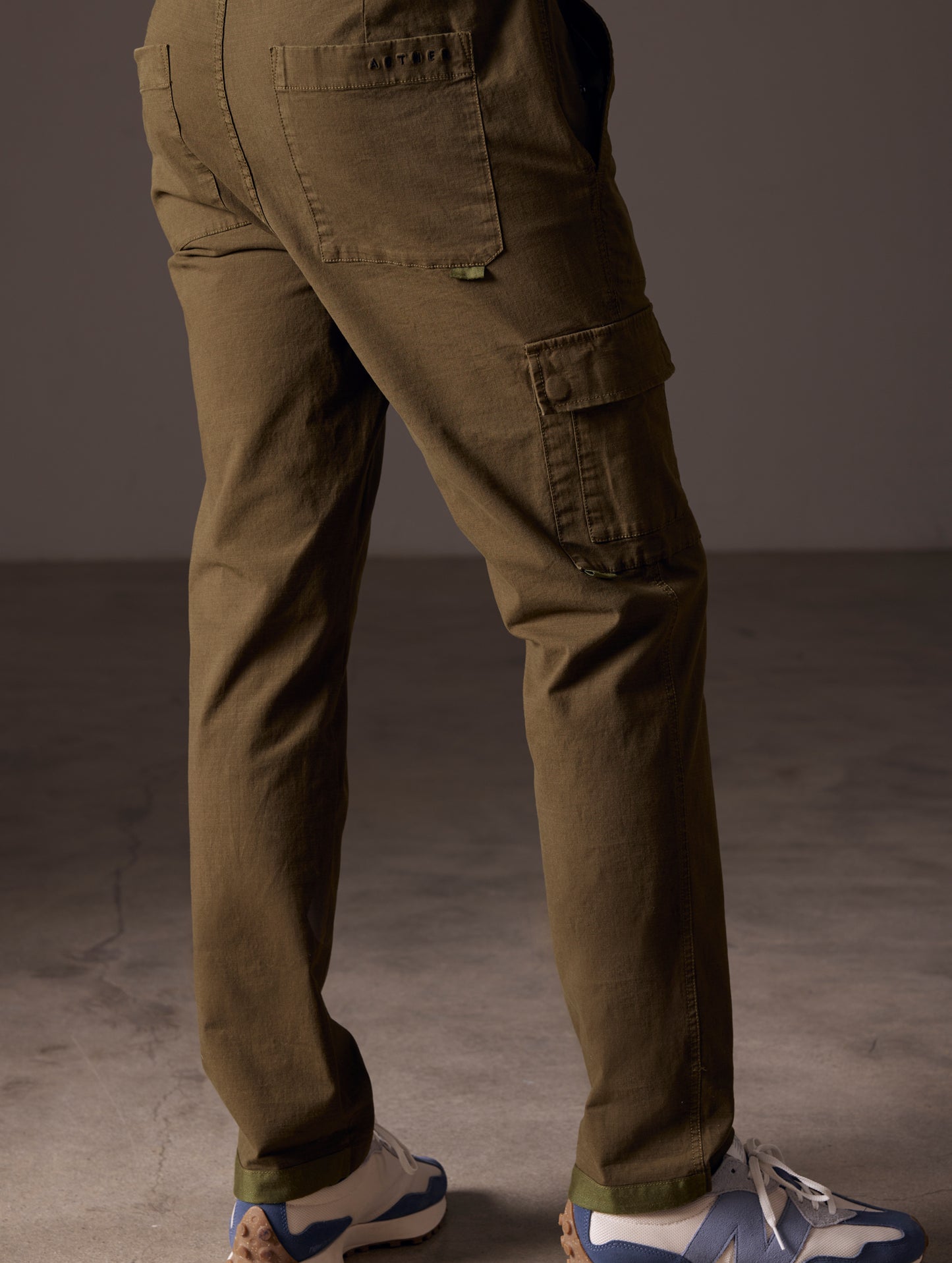 back view of man wearing green cotton ripstop pants