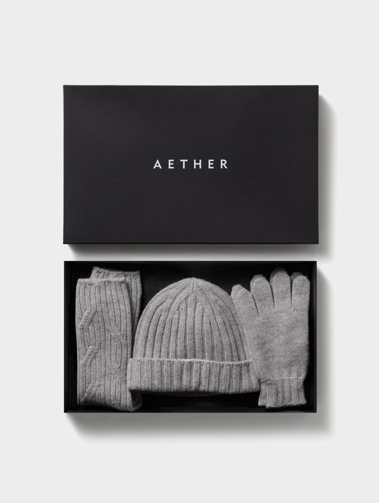Grey cashmere hat, socks, and gloves from AETHER Apparel