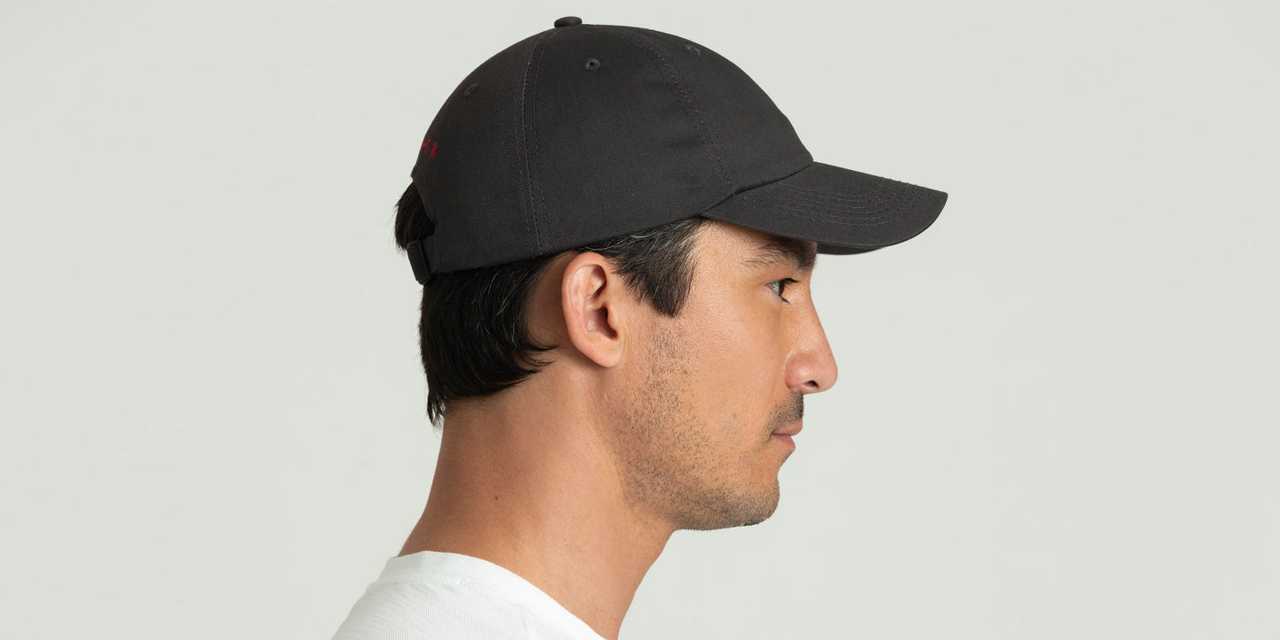 side view of man wearing dark grey hat from AETHER Apparel