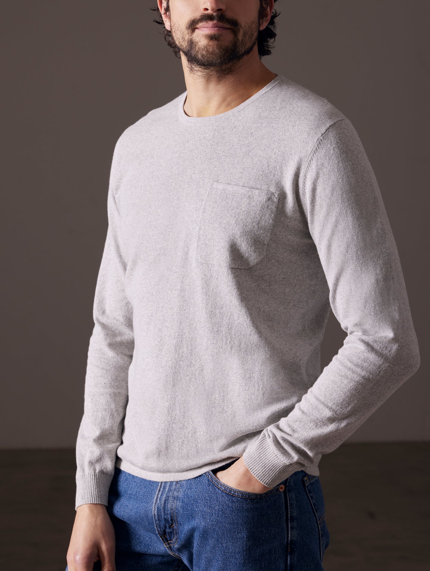 Man wearing light grey sweater from AETHER Apparel