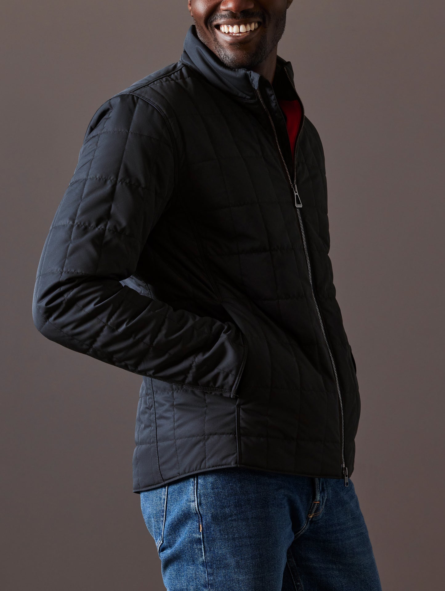 Man wearing black quilted jacket