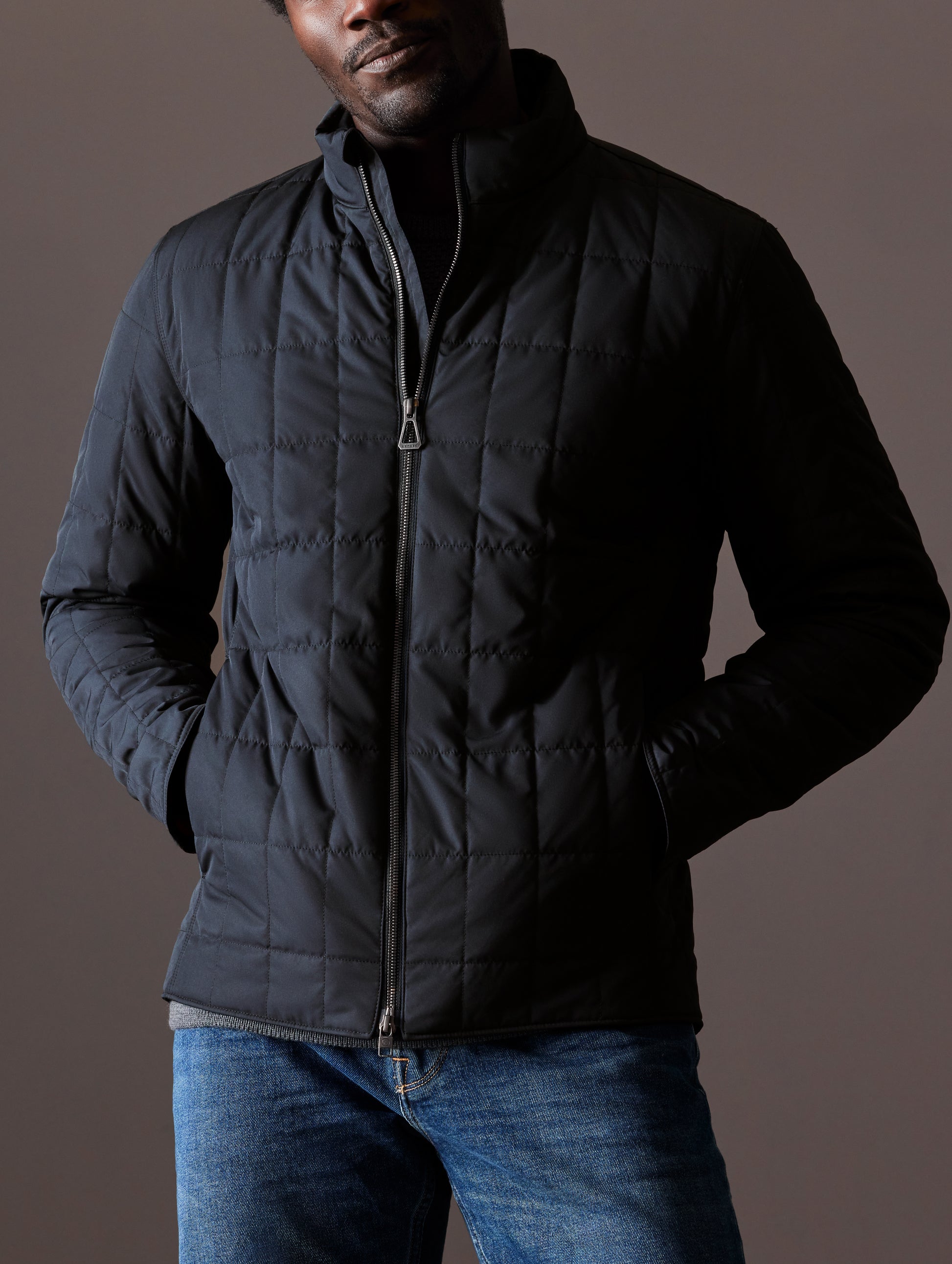 Man wearing black quilted jacket
