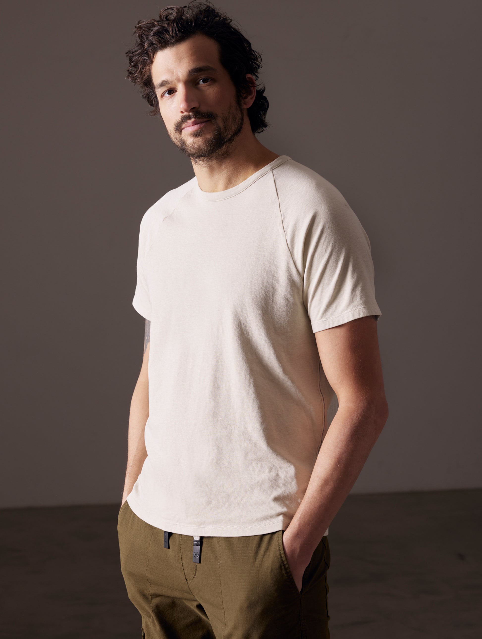 man wearing beige tee from AETHER Apparel