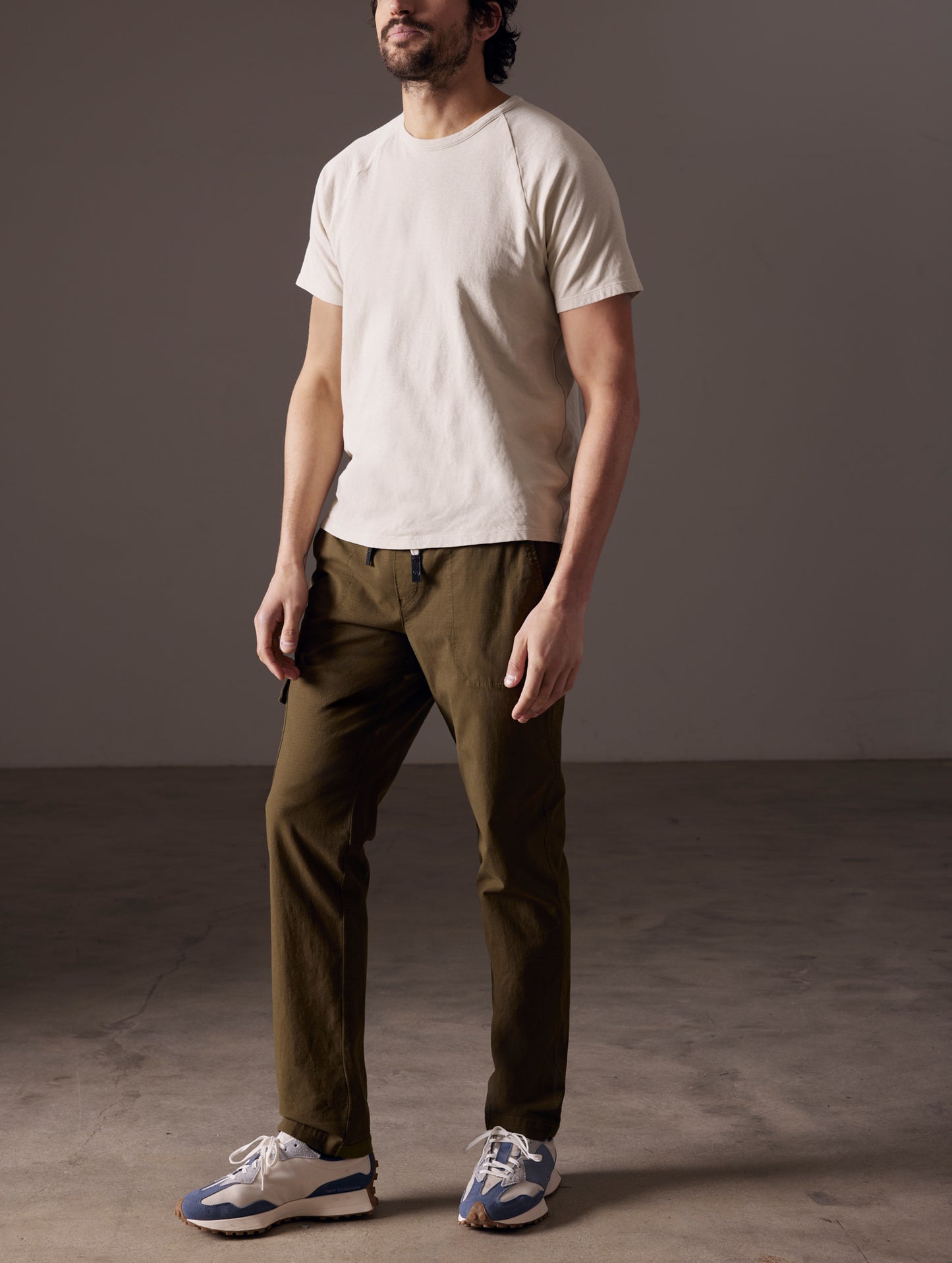 man wearing beige tee from AETHER Apparel