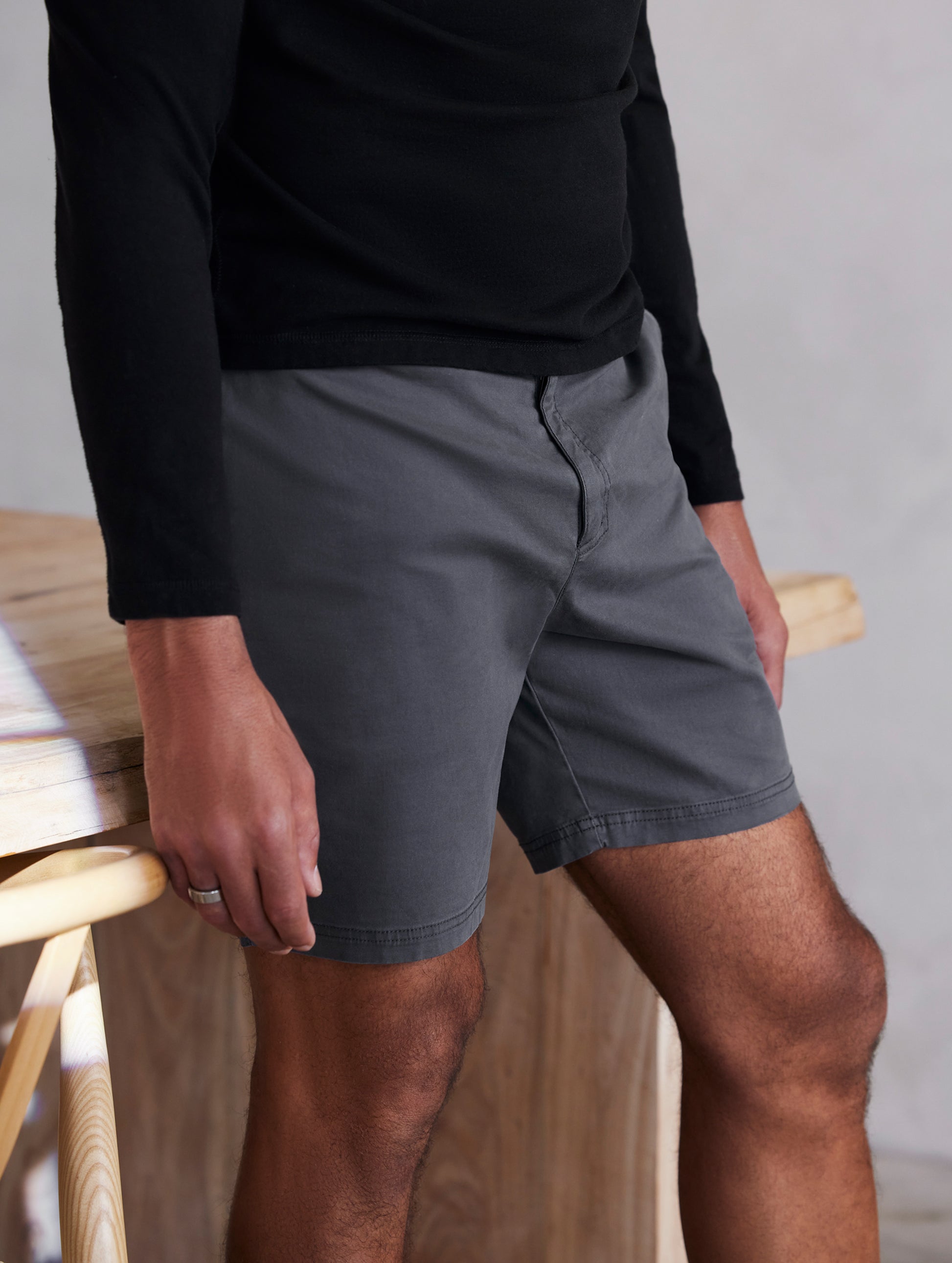 man wearing grey shorts from AETHER Apparel.