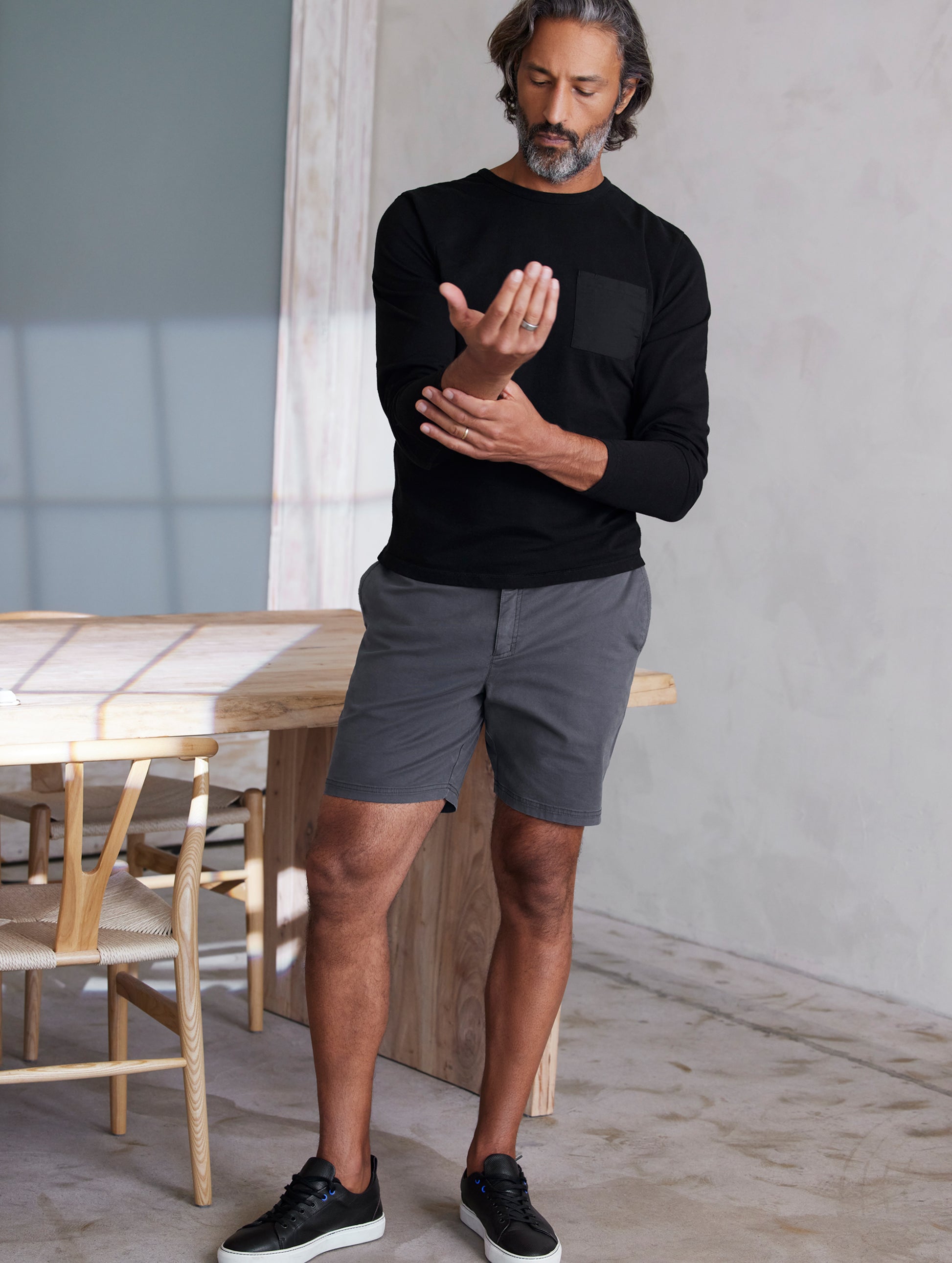 man wearing grey shorts from AETHER Apparel.