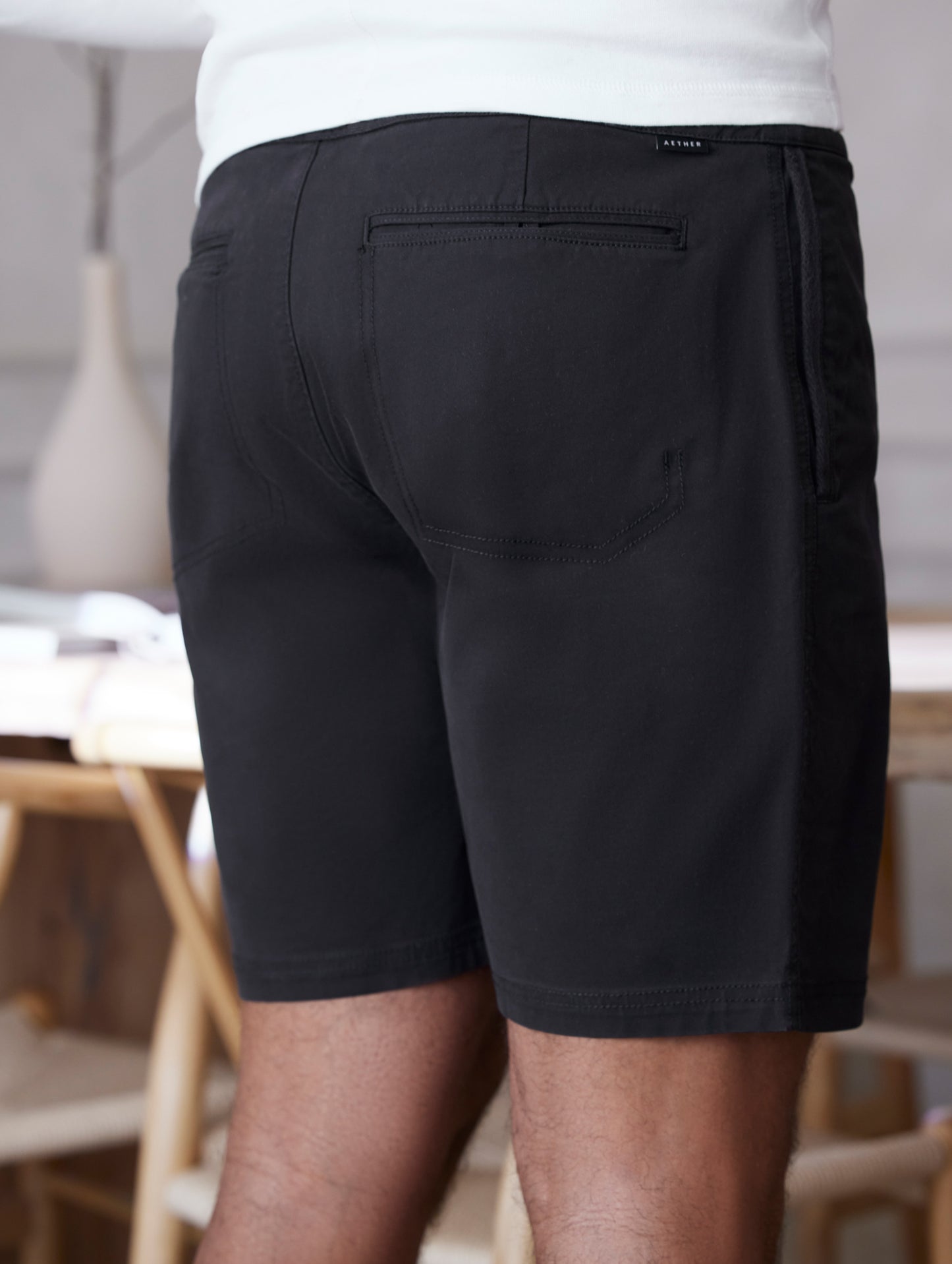 man wearing black shorts from AETHER Apparel.