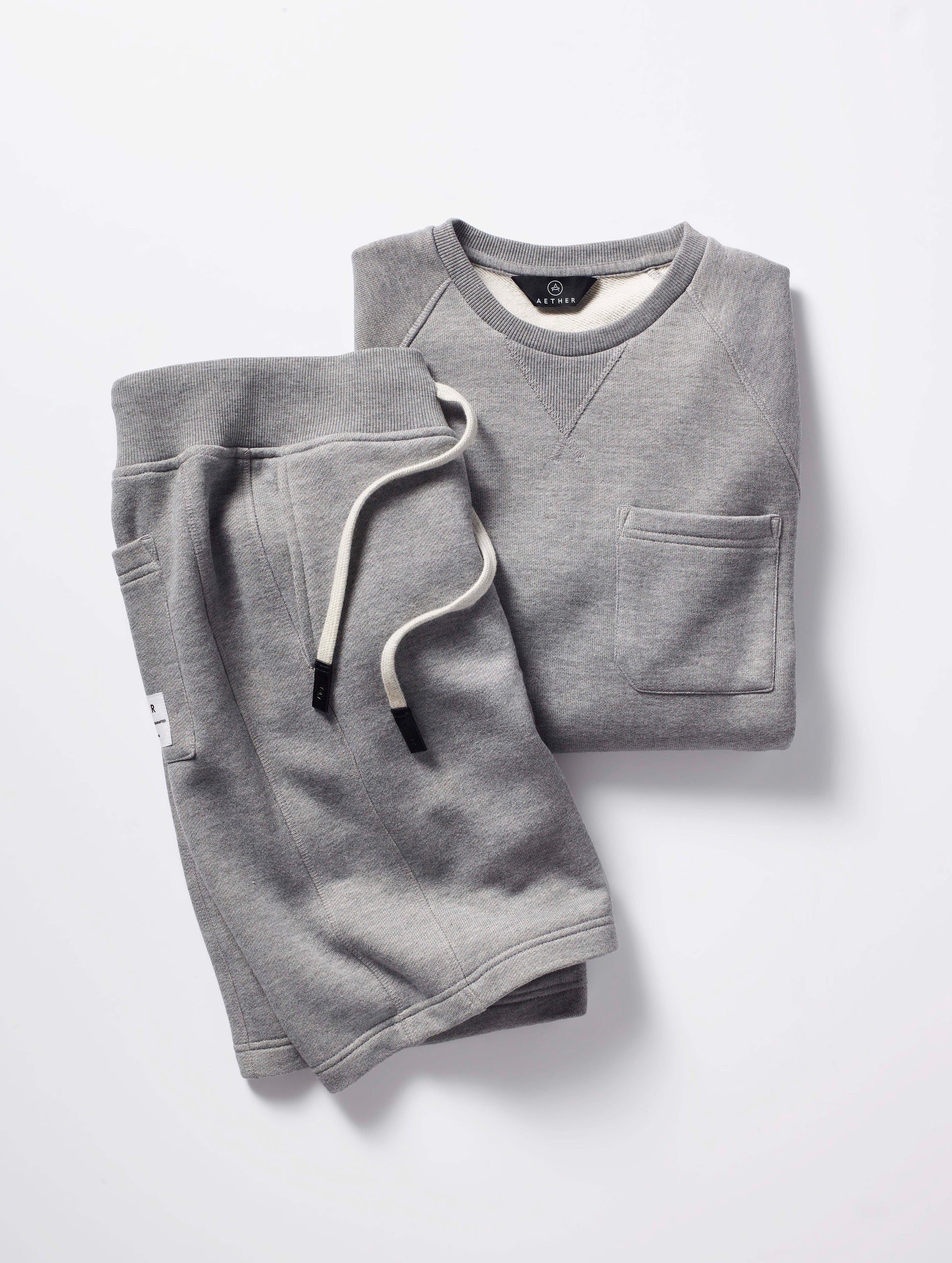 grey shorts and crew neck with pocket