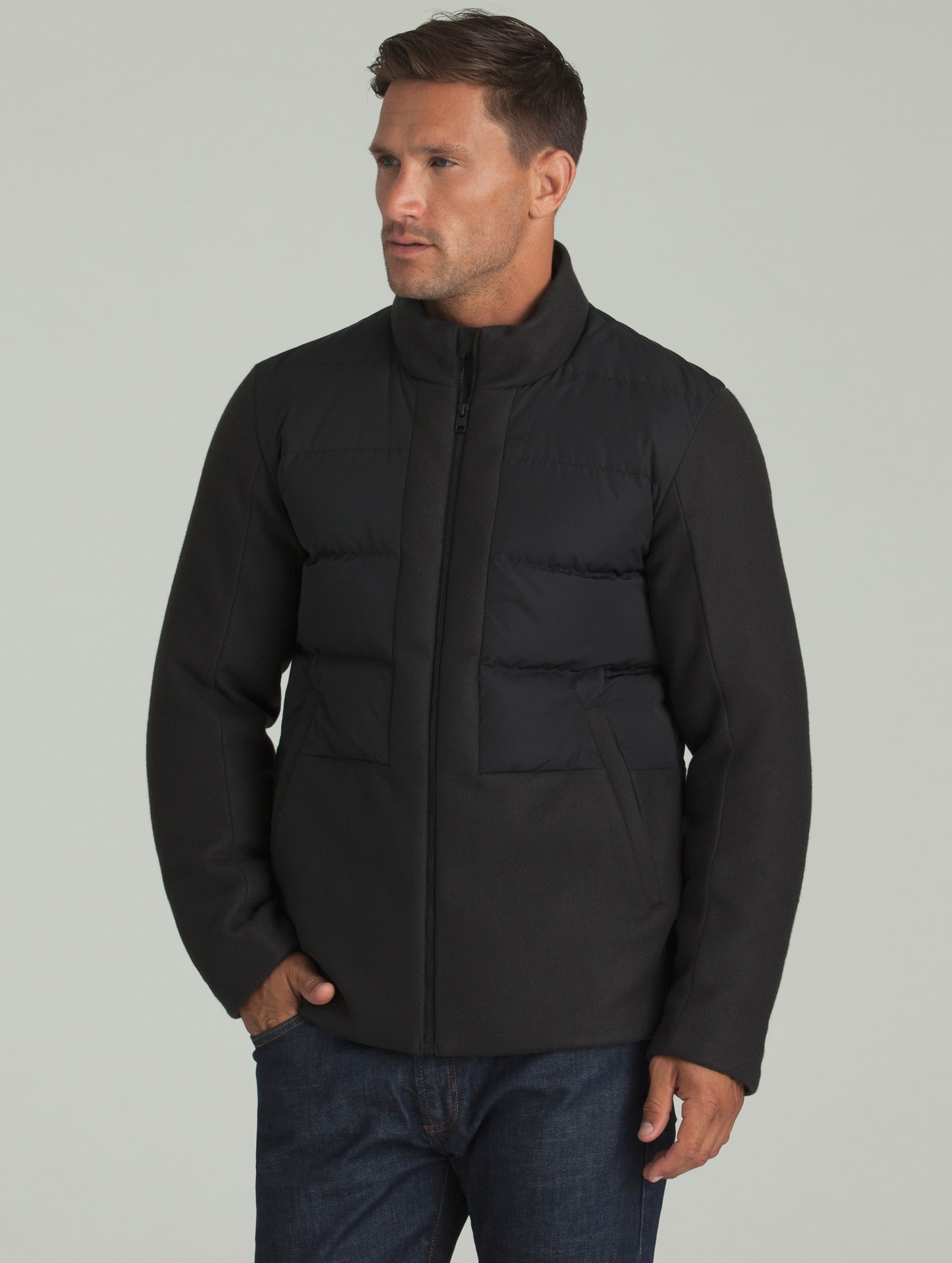 Man wearing black Hopkins Jacket from AETHER Apparel.