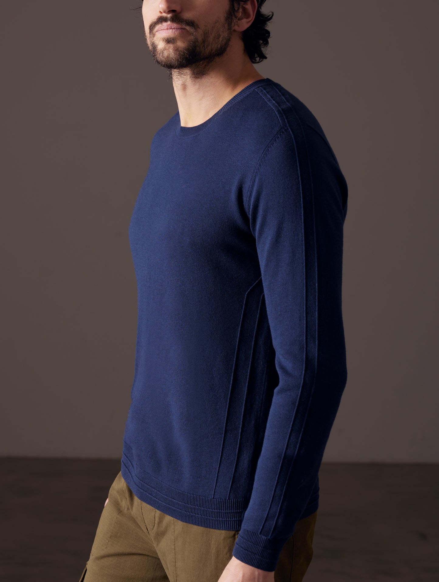 Man wearing blue sweater from AETHER Apparel