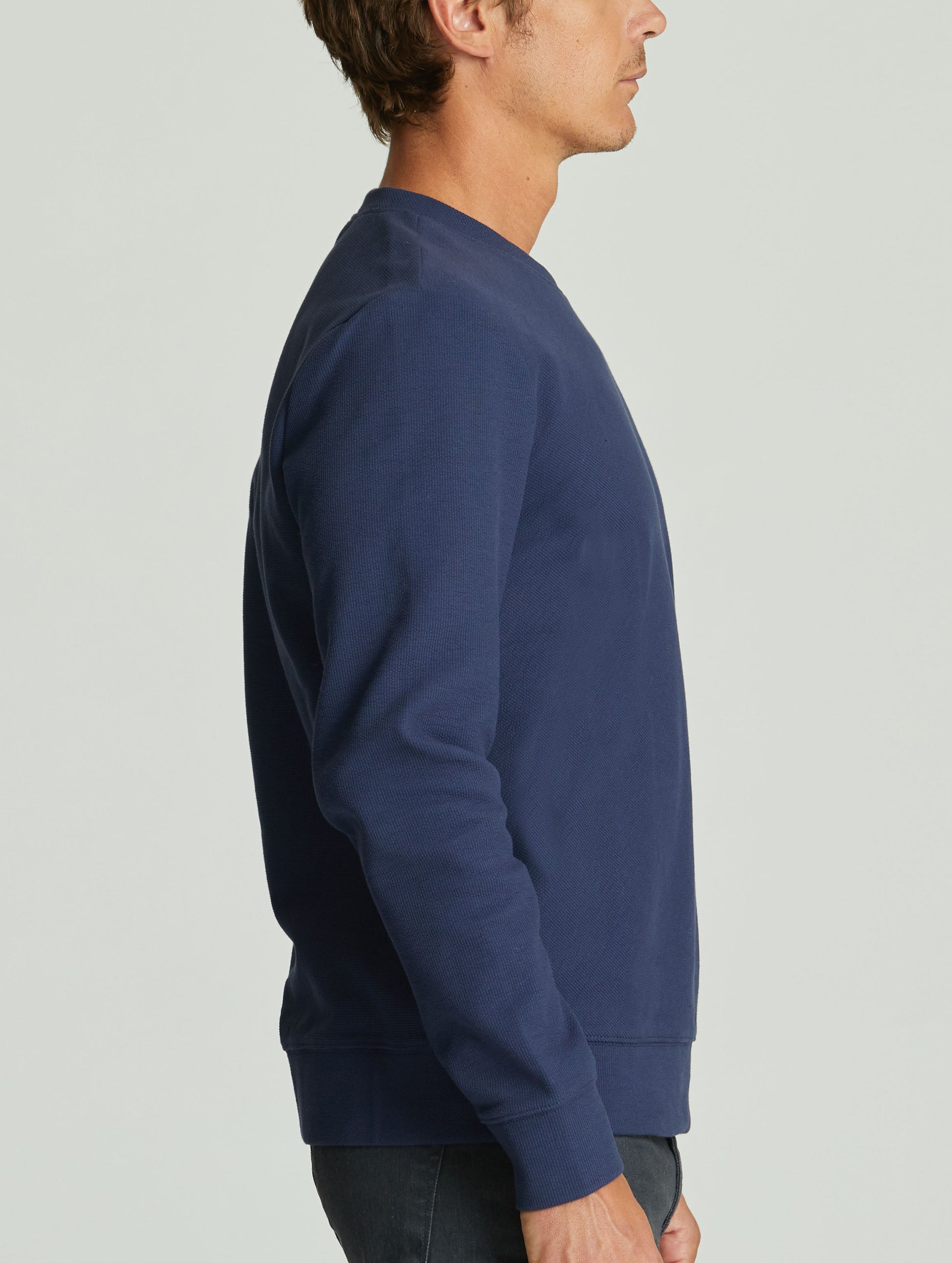 man wearing blue pullover