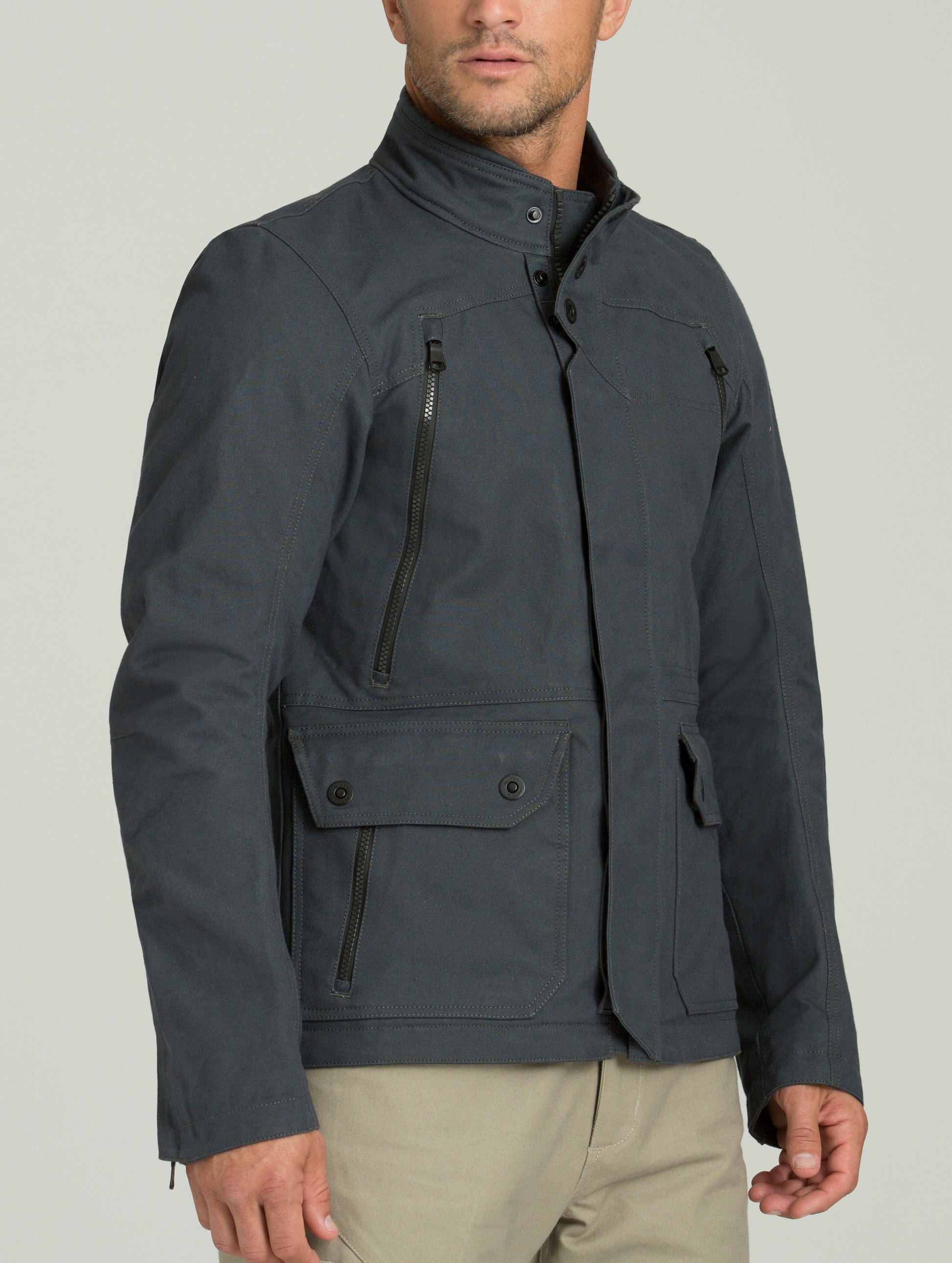 Front 3/4 body view of man wearing Mojave Motorcycle Jacket in Graphite from AETHER Apparel.