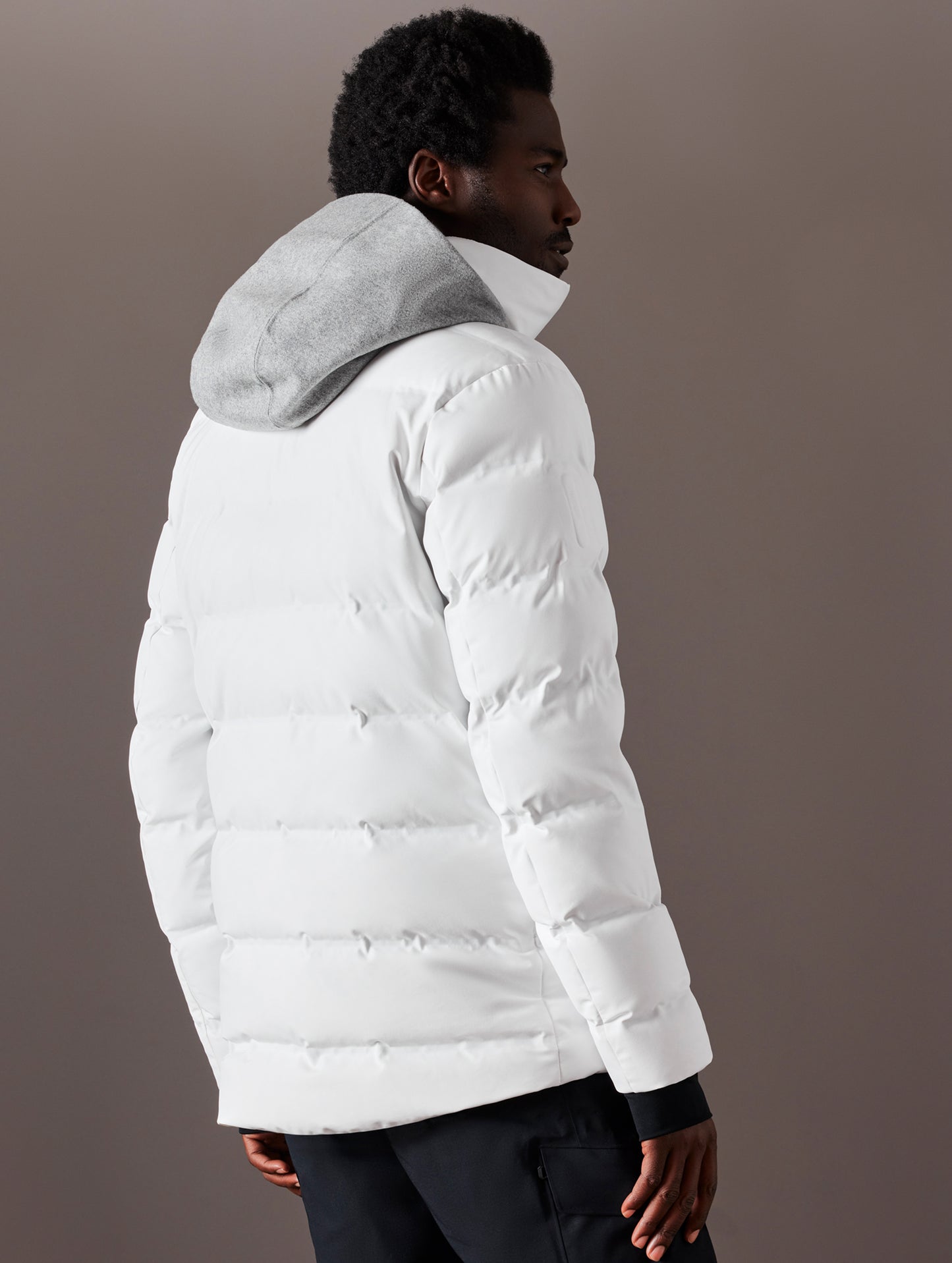 man wearing white ski jacket from AETHER Apparel