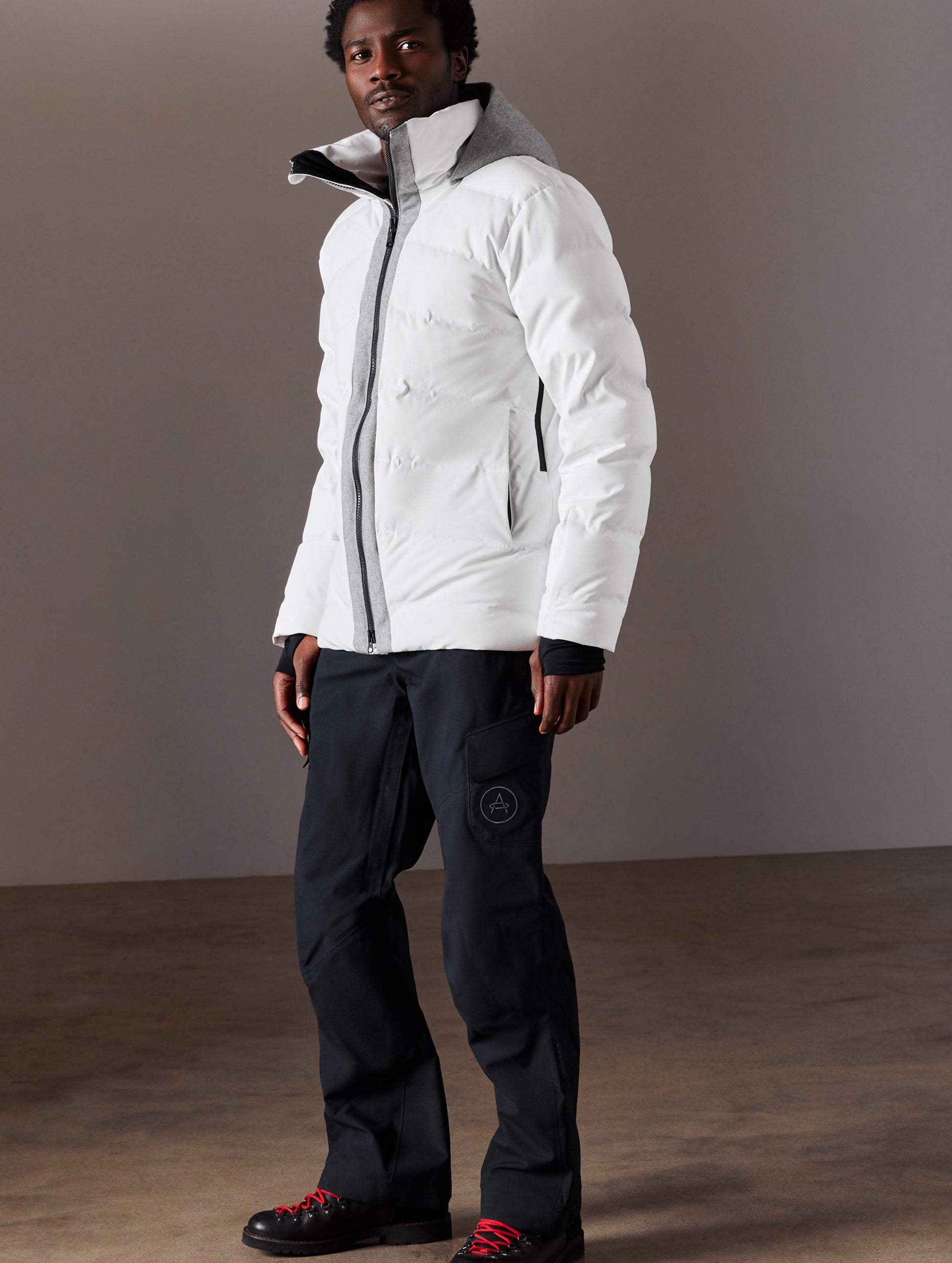 man wearing white ski jacket from AETHER Apparel