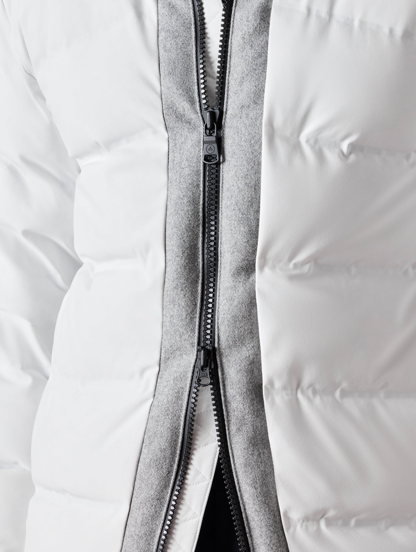 close up of white men's ski jacket from AETHER Apparel