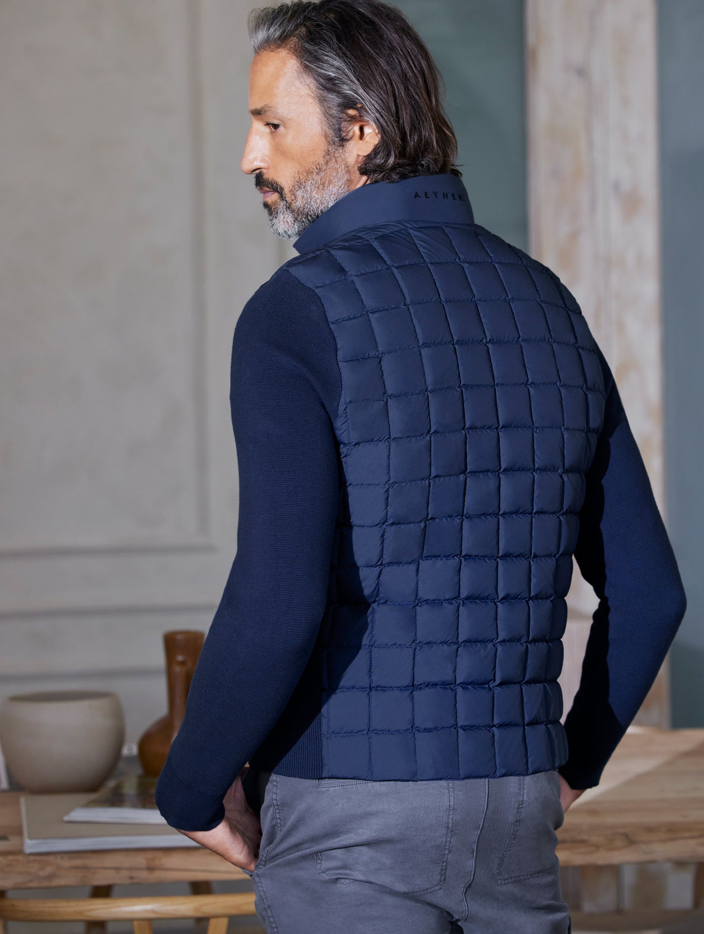 man wearing quilted blue full-zip sweater