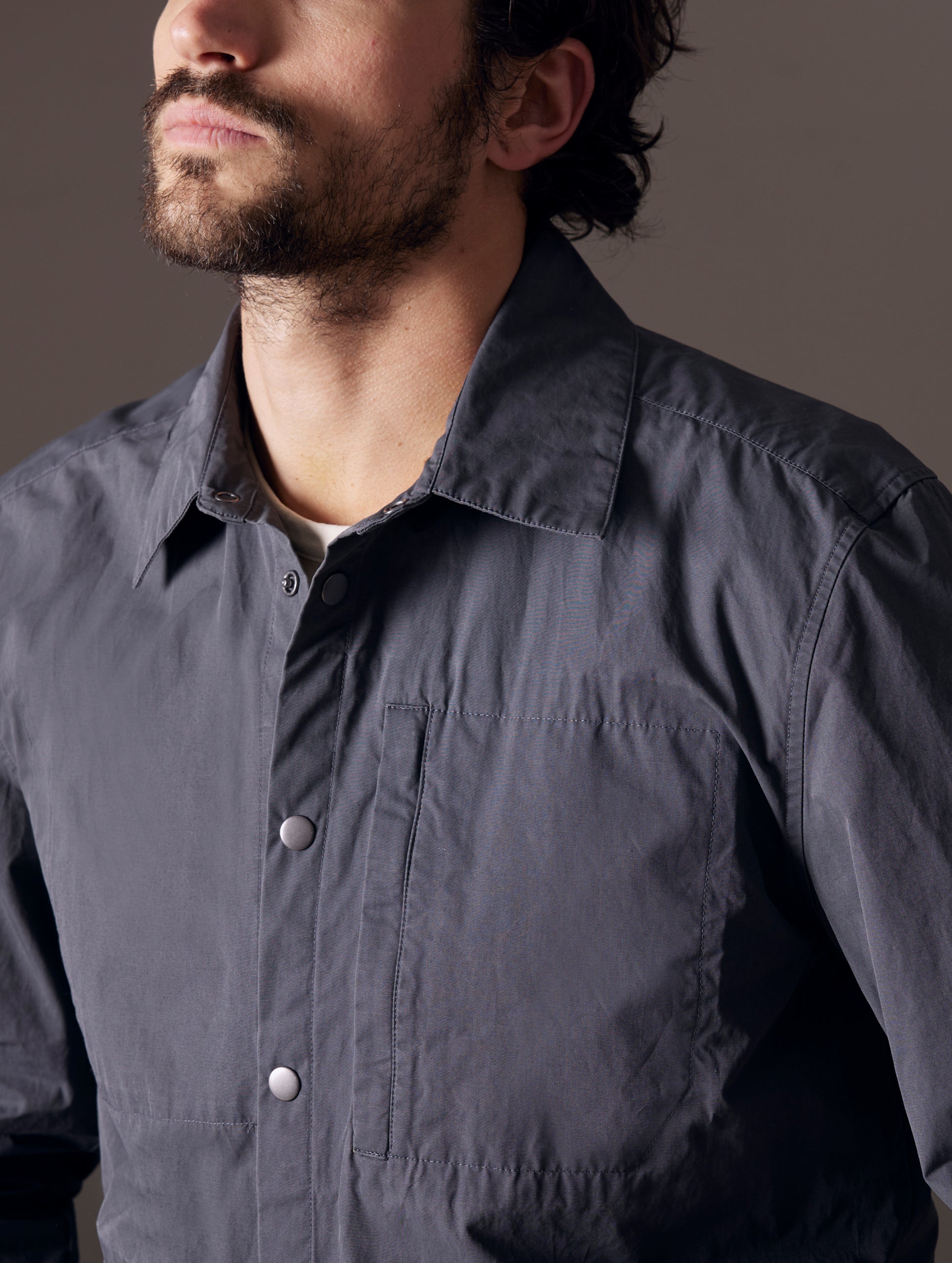 Closeup detailed view of buttons and collar of Pine Shacket in Graphite from AETHER Apparel.