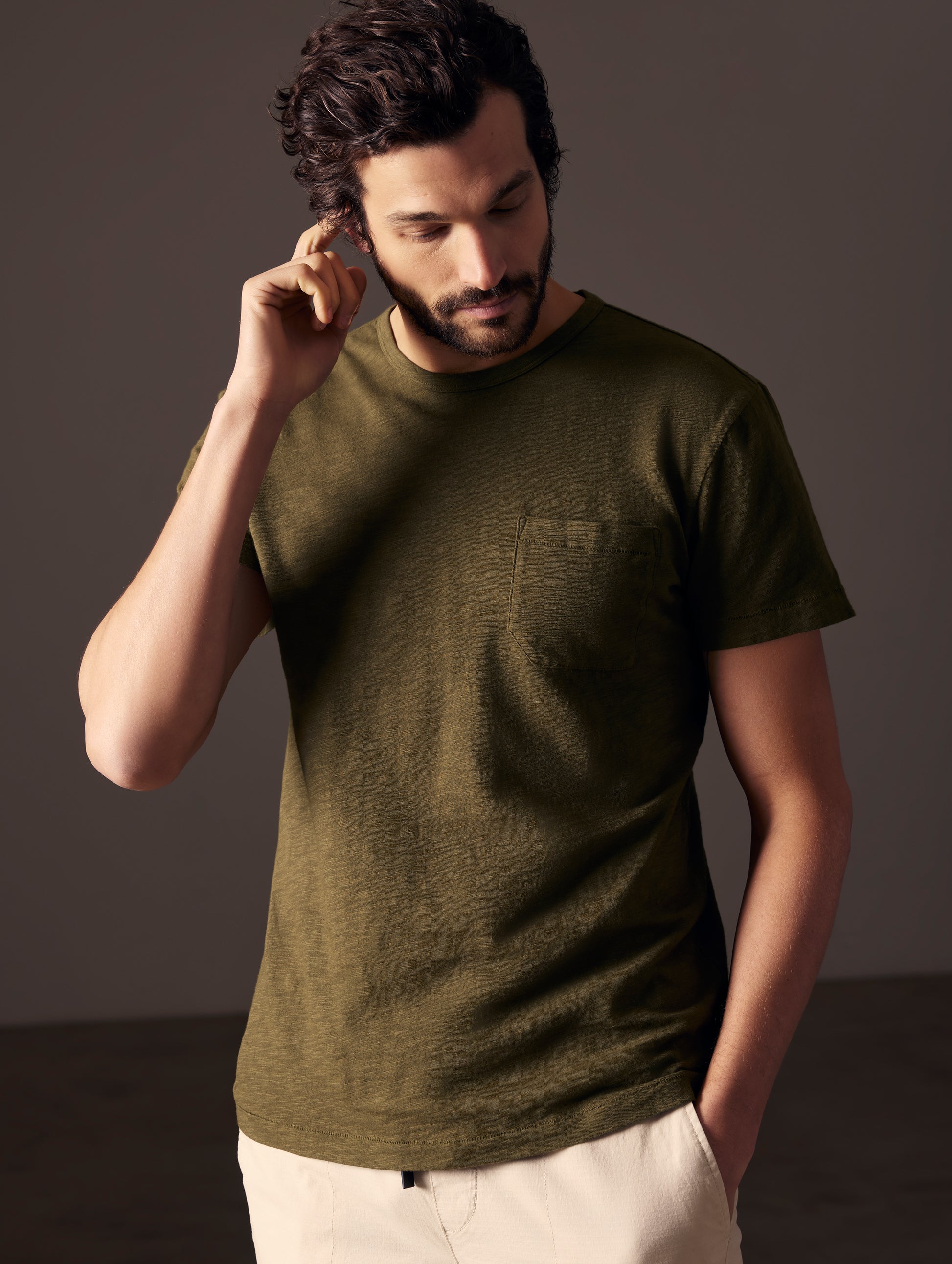 man wearing green tee from AETHER Apparel
