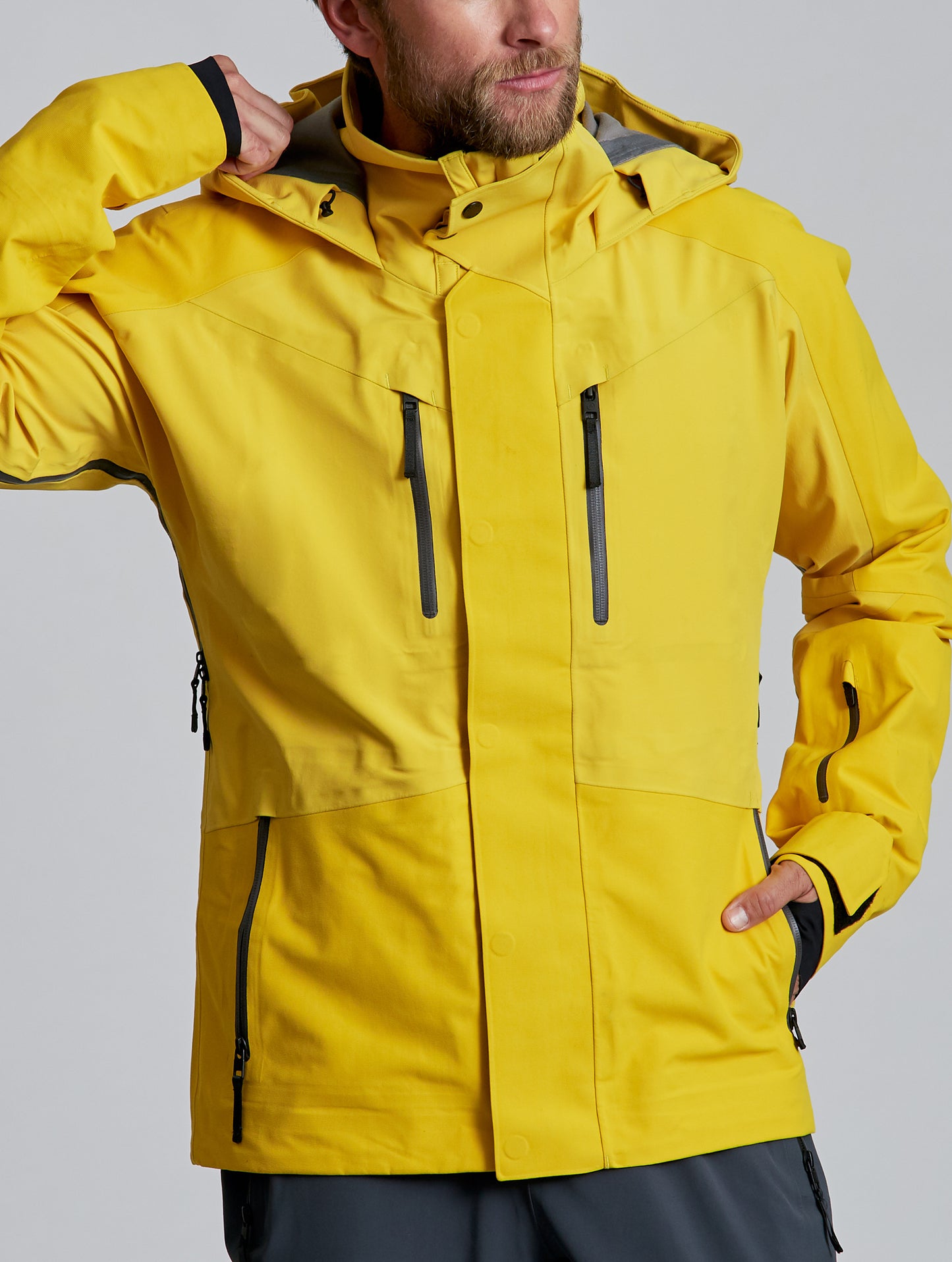 man wearing yellow snow jacket