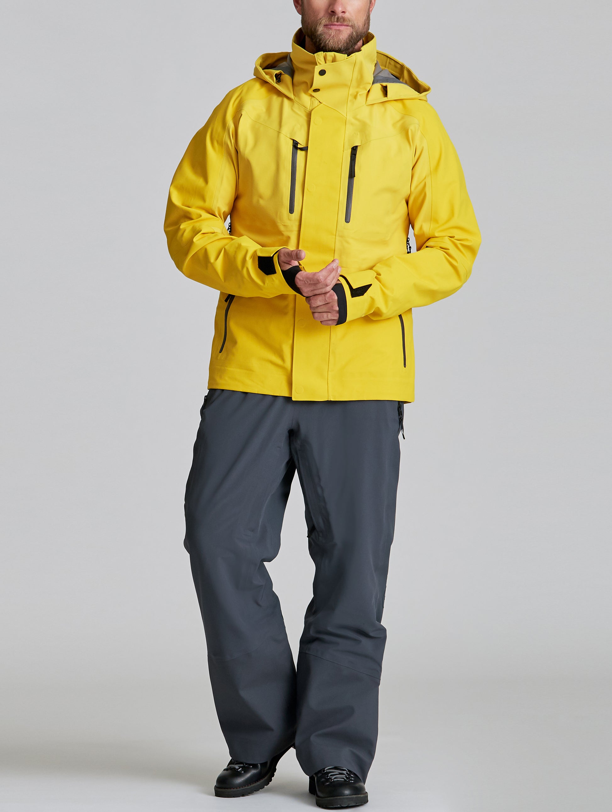 man wearing yellow snow jacket