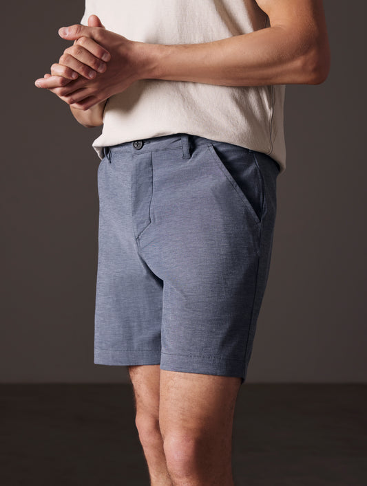 man wearing blue swim shorts from AETHER Apparel