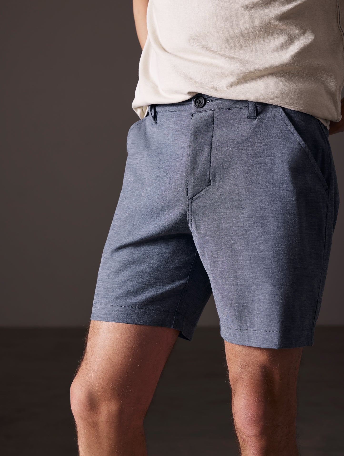 man wearing blue swim shorts from AETHER Apparel