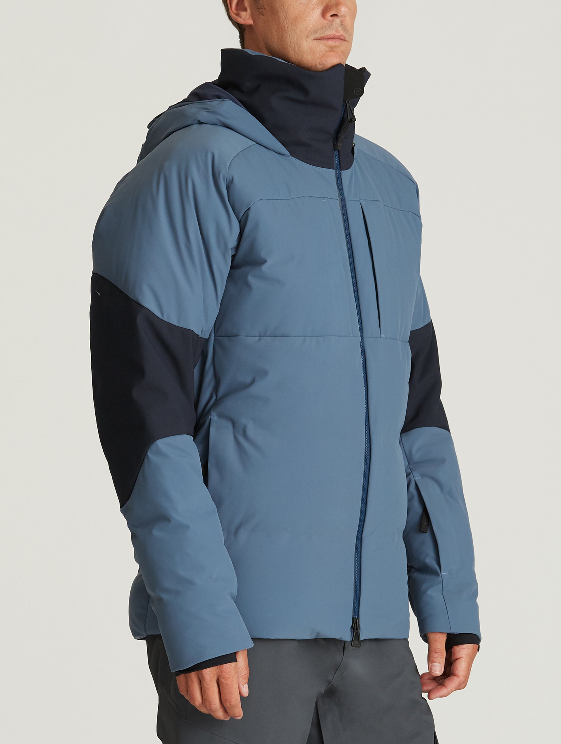 man wearing blue ski jacket from Aether Apparel