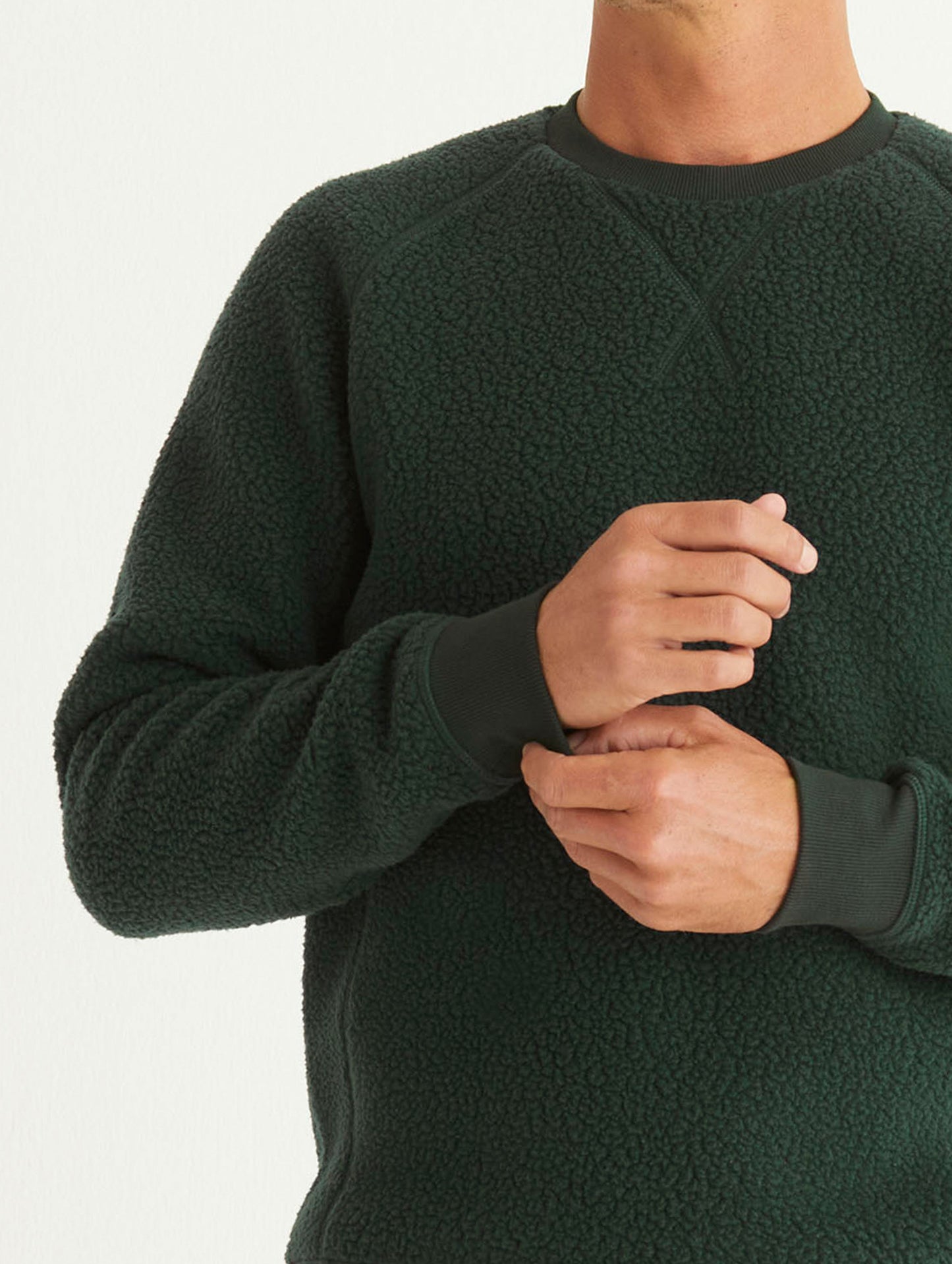 man wearing green fleece sweater