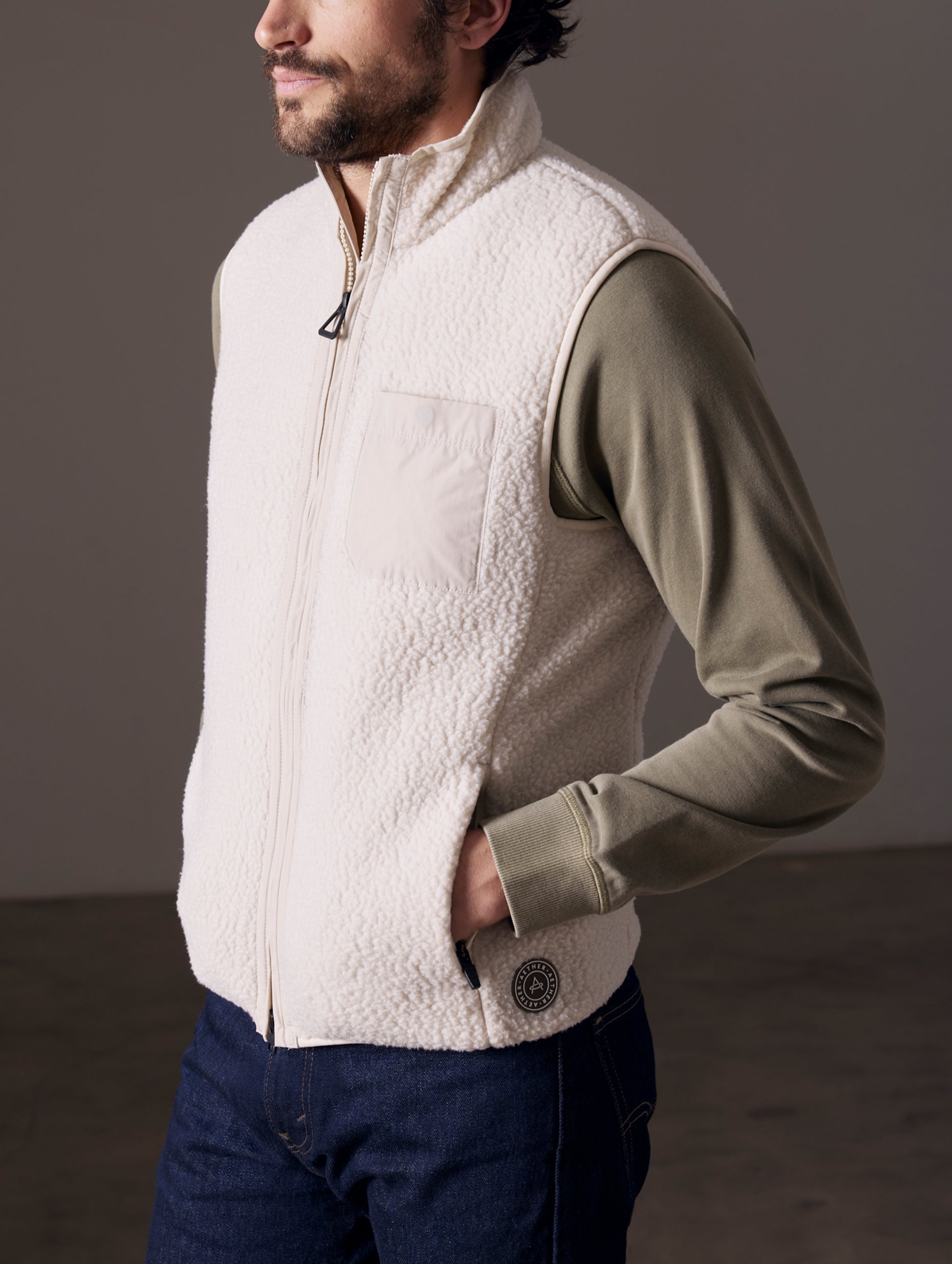man wearing beige fleece vest
