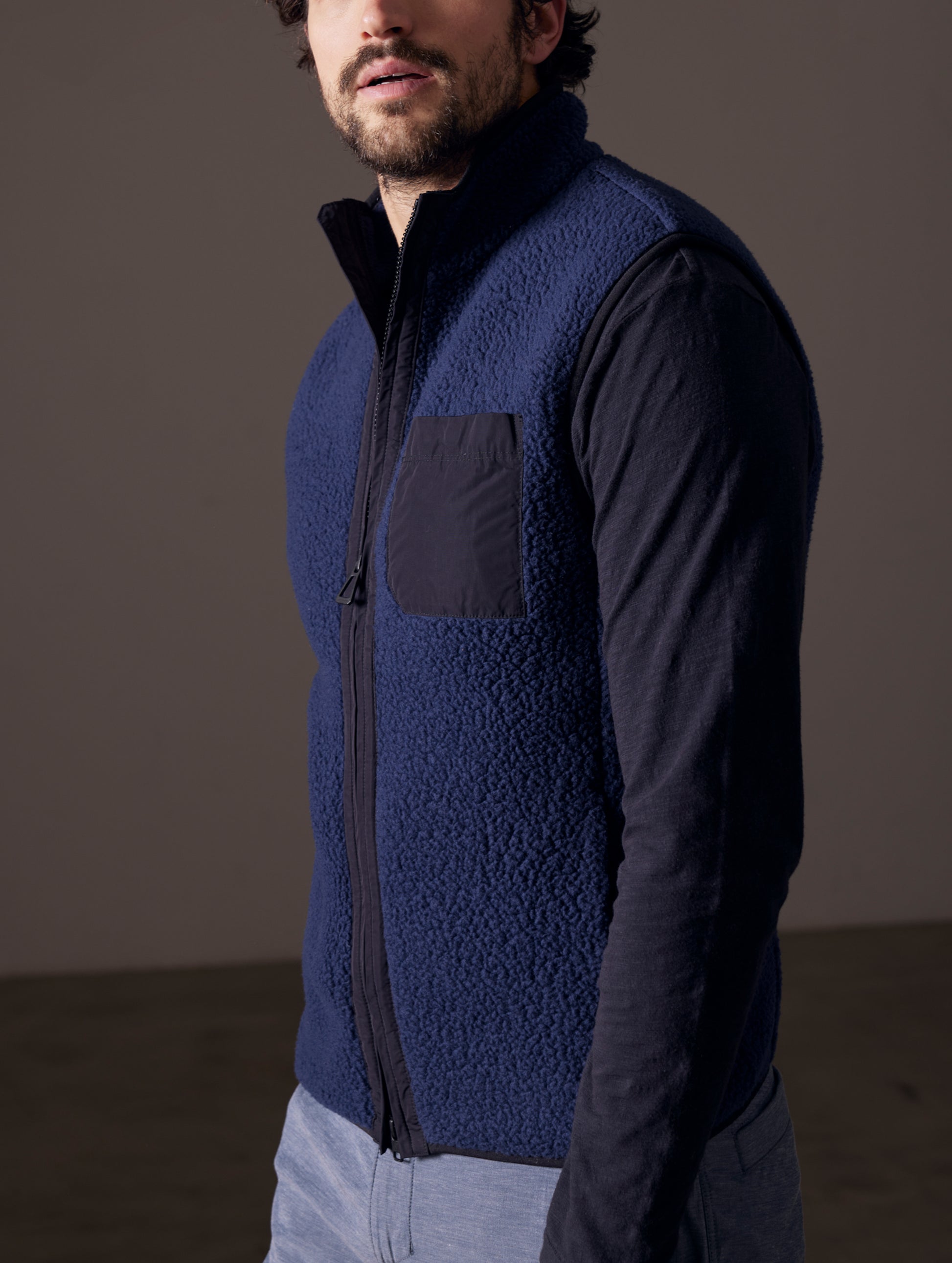 man wearing blue fleece vest