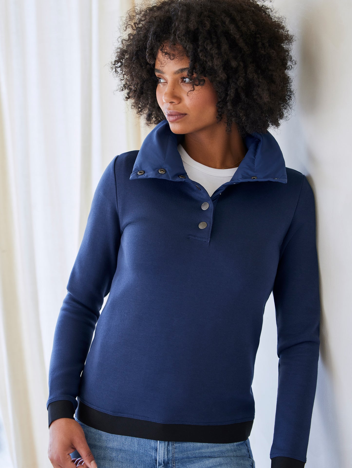 Woman wearing blue Align Pullover from AETHER Apparel
