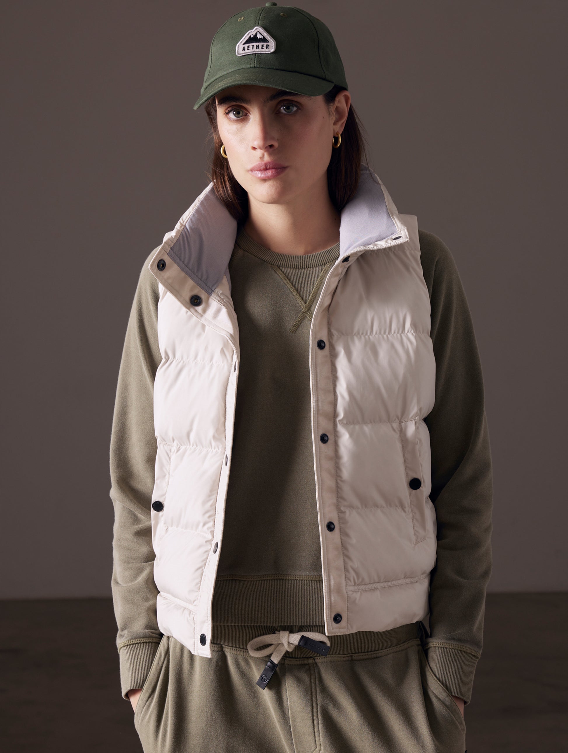 woman wearing beige insulated vest from AETHER Apparel