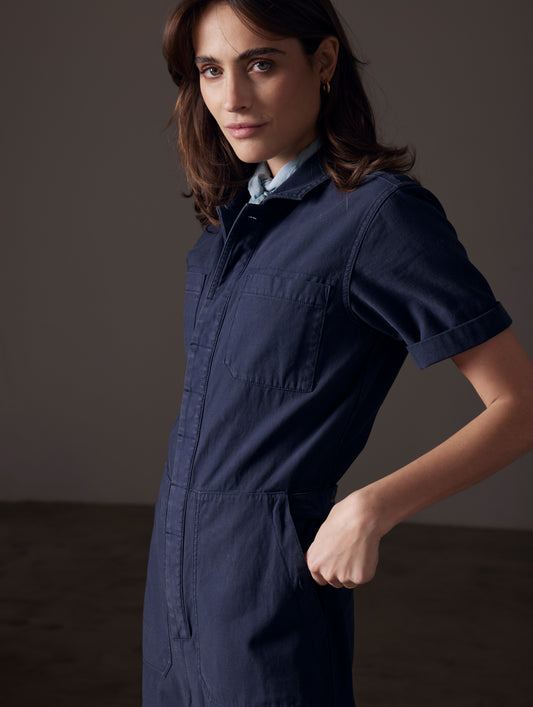woman wearing blue short-sleeve jumpsuit from AETHER Apparel