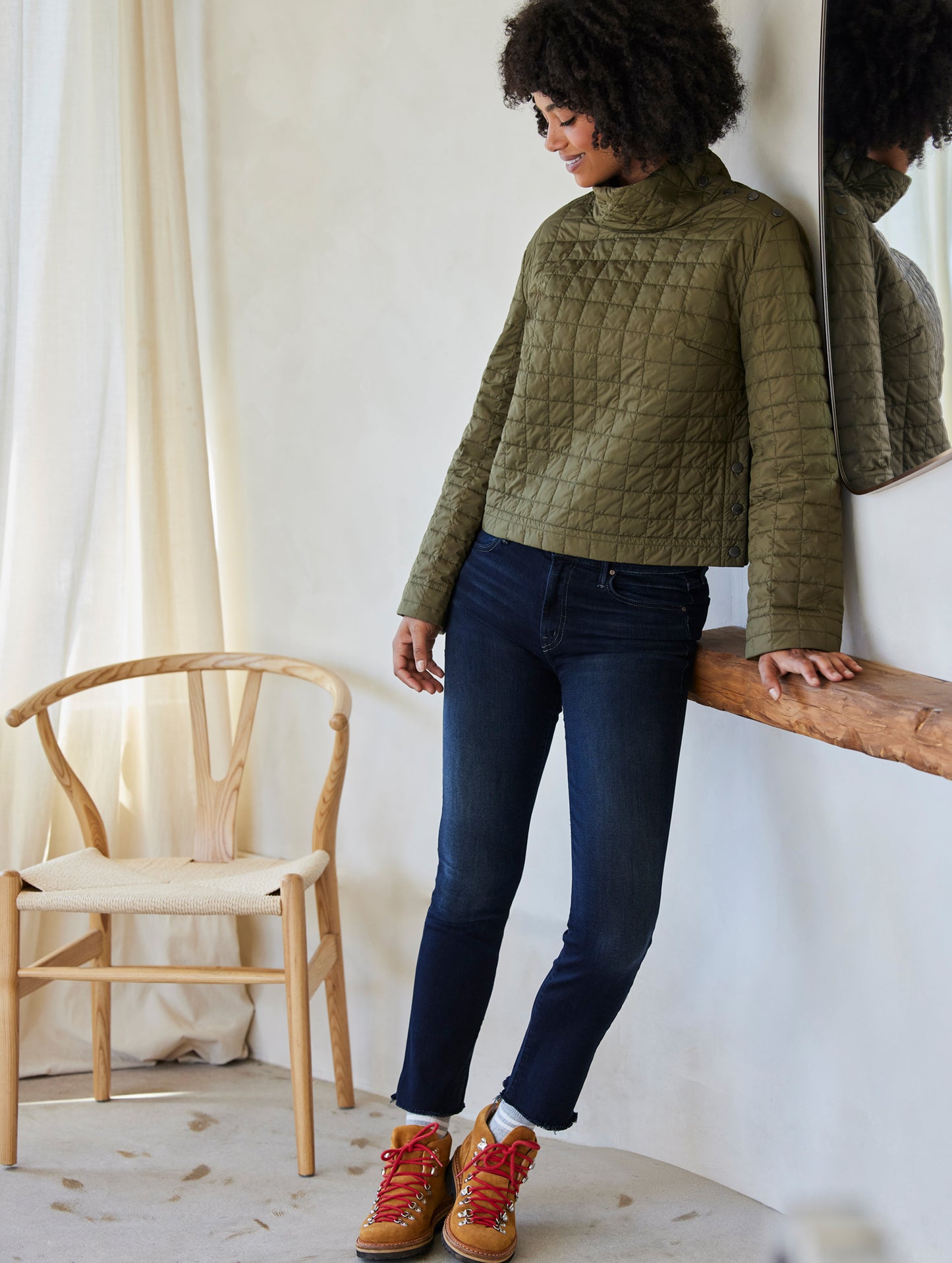 woman wearing quilted green pullover
