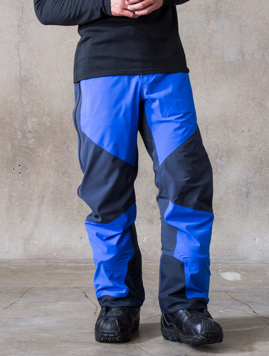 Man wearing blue Fusion Pant from AETHER Apparel.
