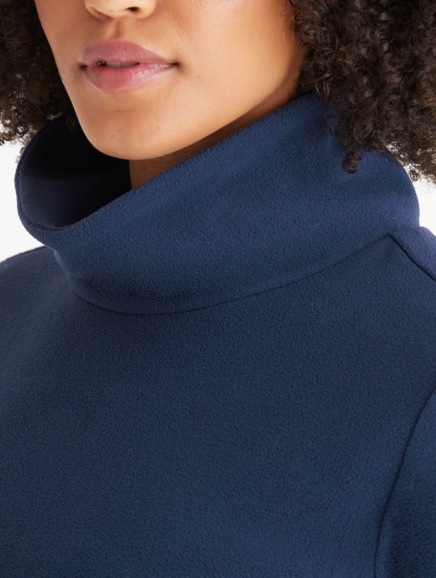 woman wearing blue high neck pullover