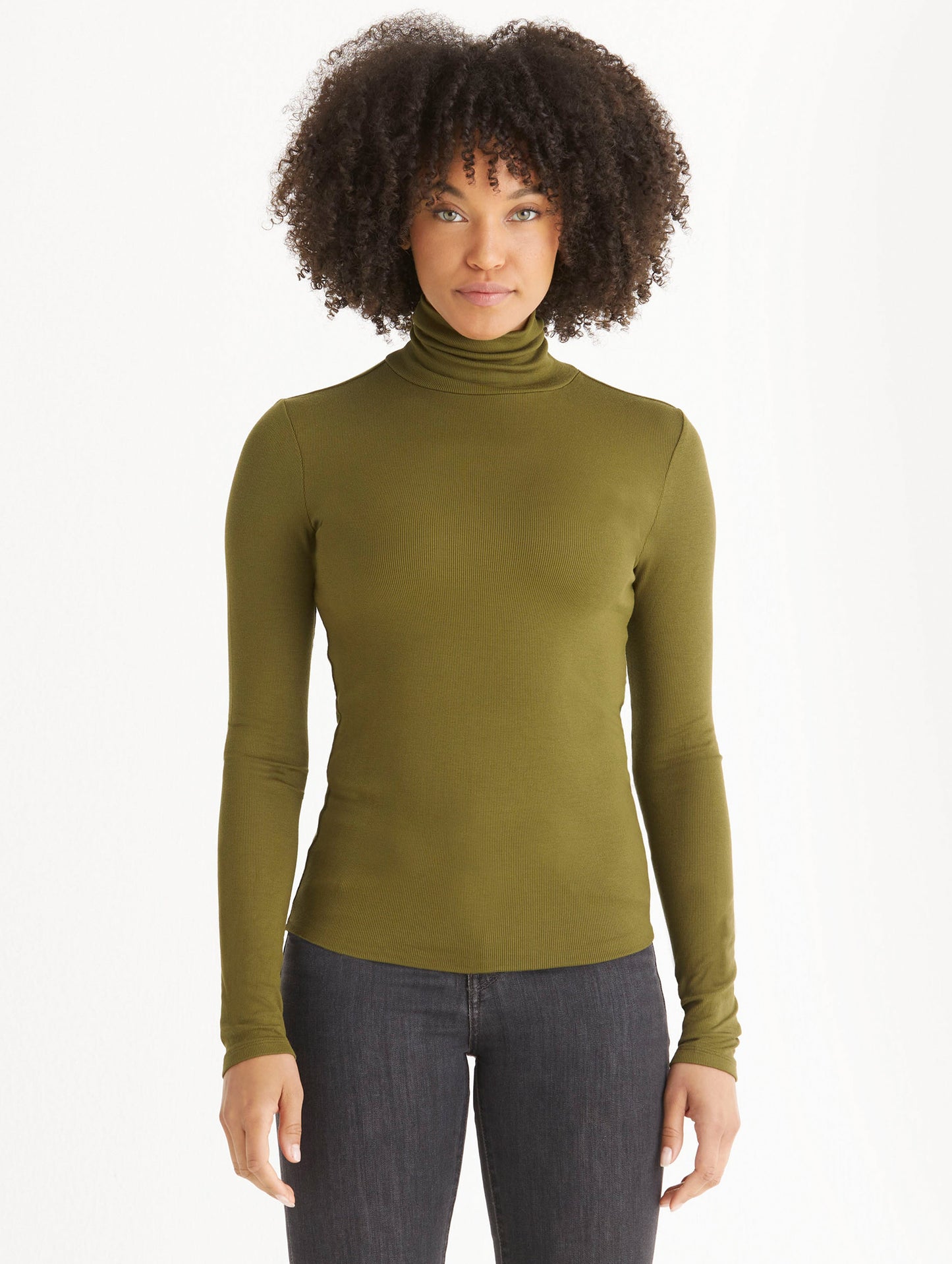 woman wearing green turtleneck shirt from Aether Apparel