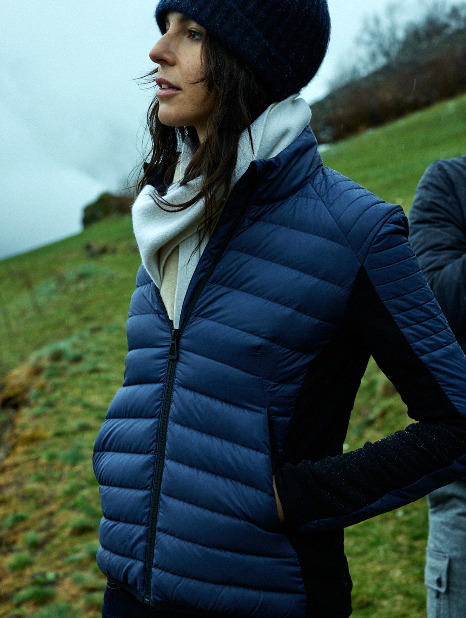 woman wearing quilted blue jacket