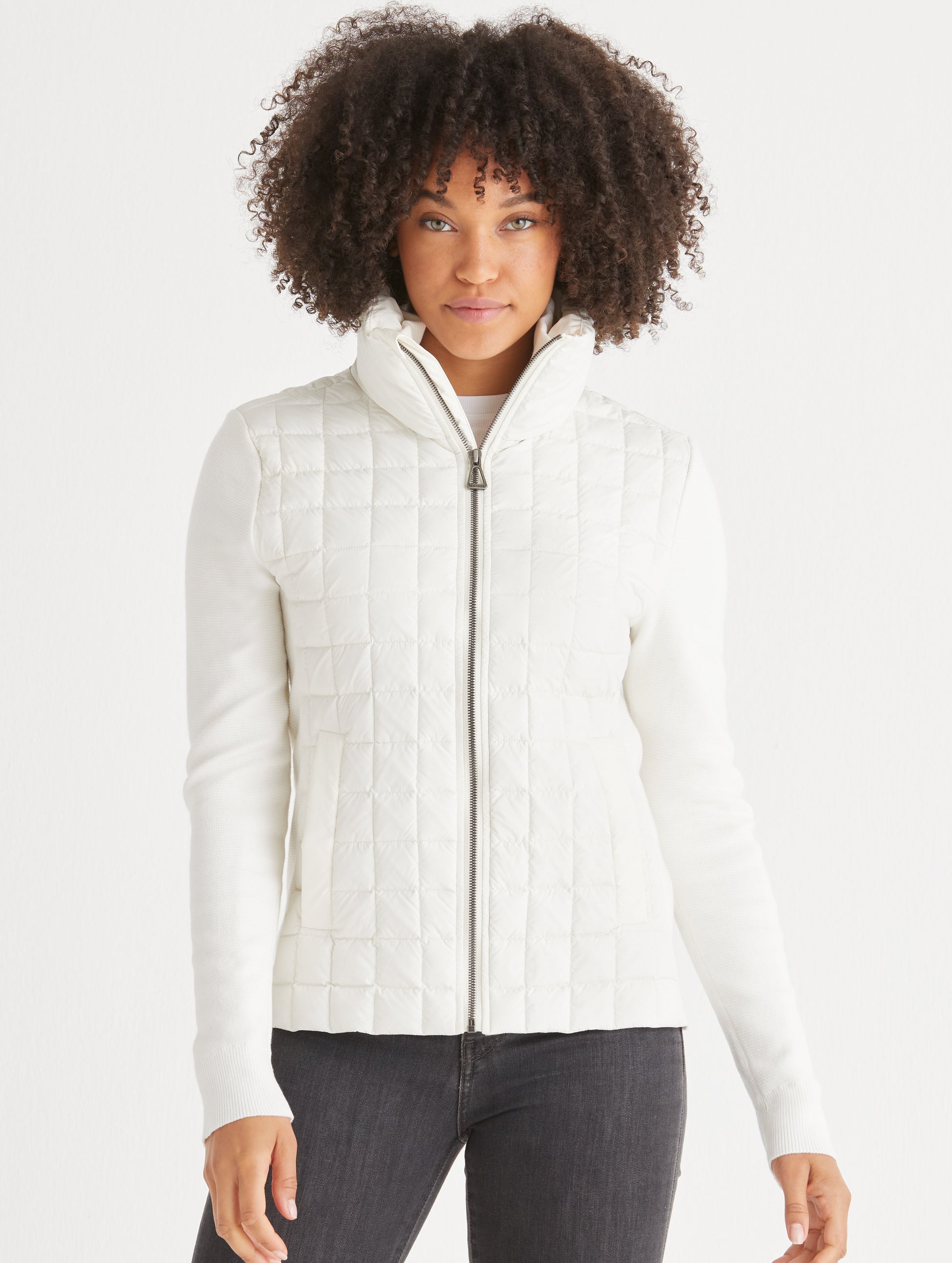 woman wearing quilted white full-zip sweater