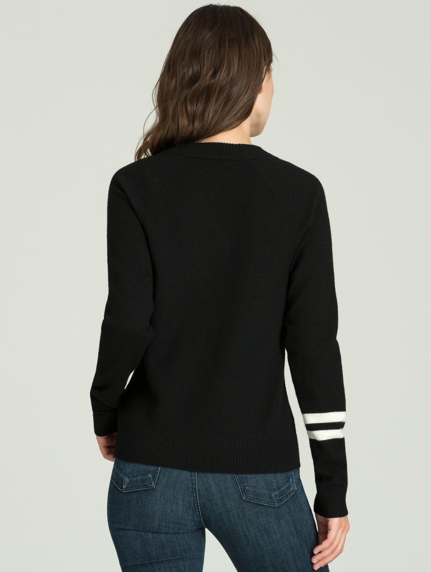 Rear view of woman wearing Racer Sweater in Onyx Black from AETHER Apparel.