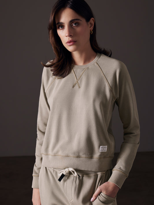 woman wearing light grey pullover from AETHER Apparel