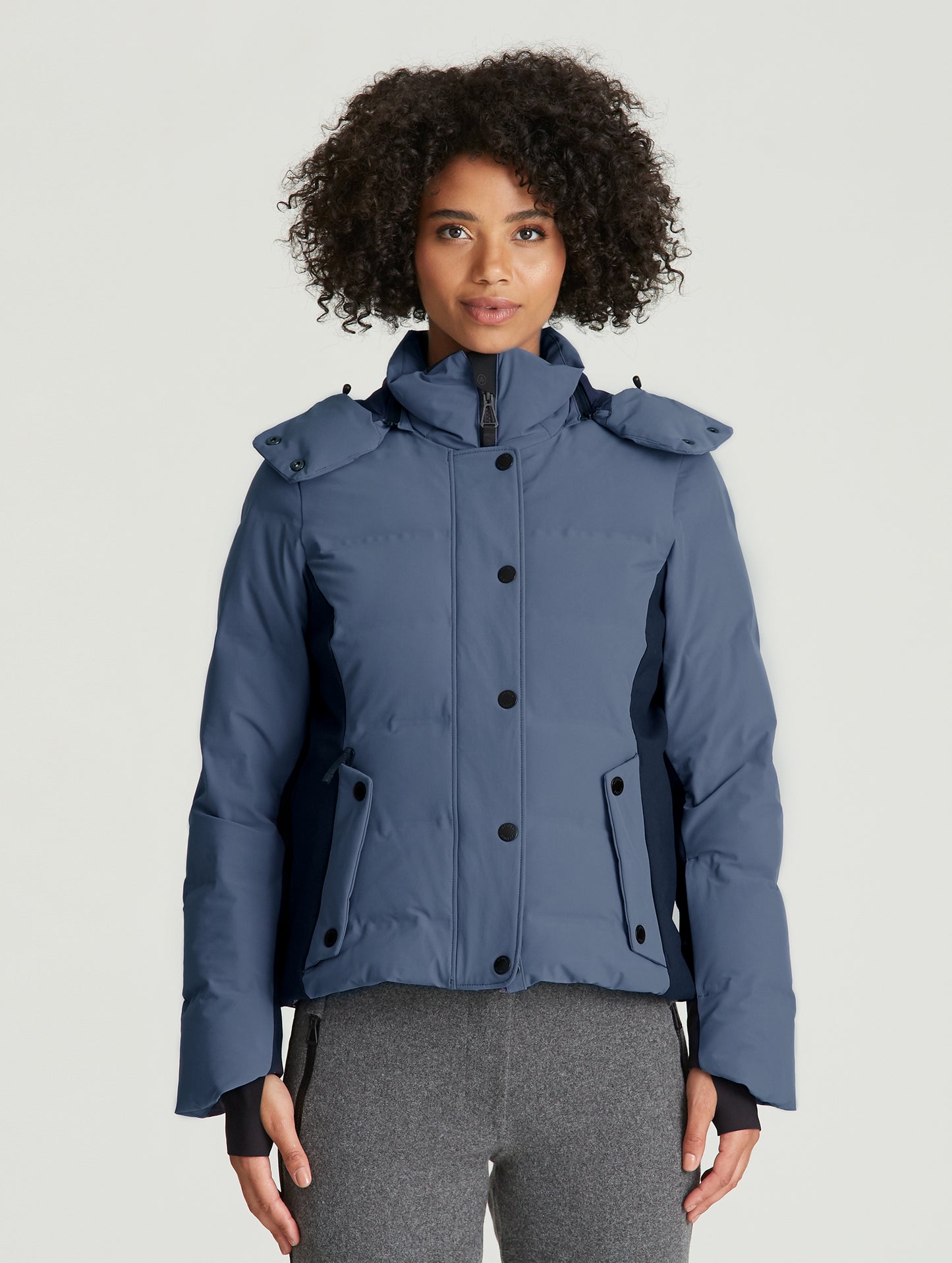 woman wearing blue ski jacket from Aether Apparel